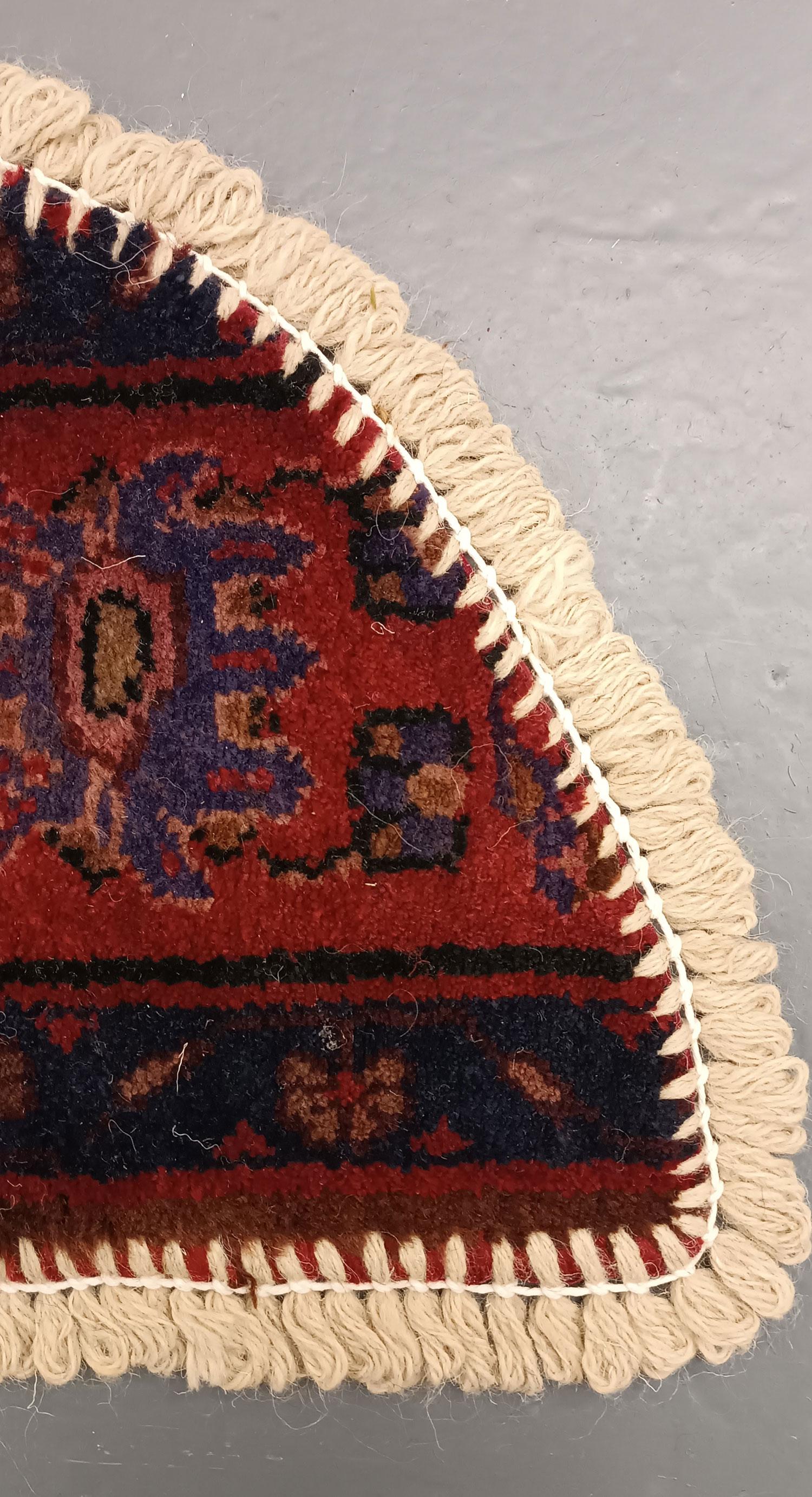 Handmade carpet Oriental rug featuring a traditional floral pattern woven in deep rich tones created by organic vegetable dyes on lamb wool, this little mat is perfect for any modern or traditional home doorway. This semi-circle entranceway doormat