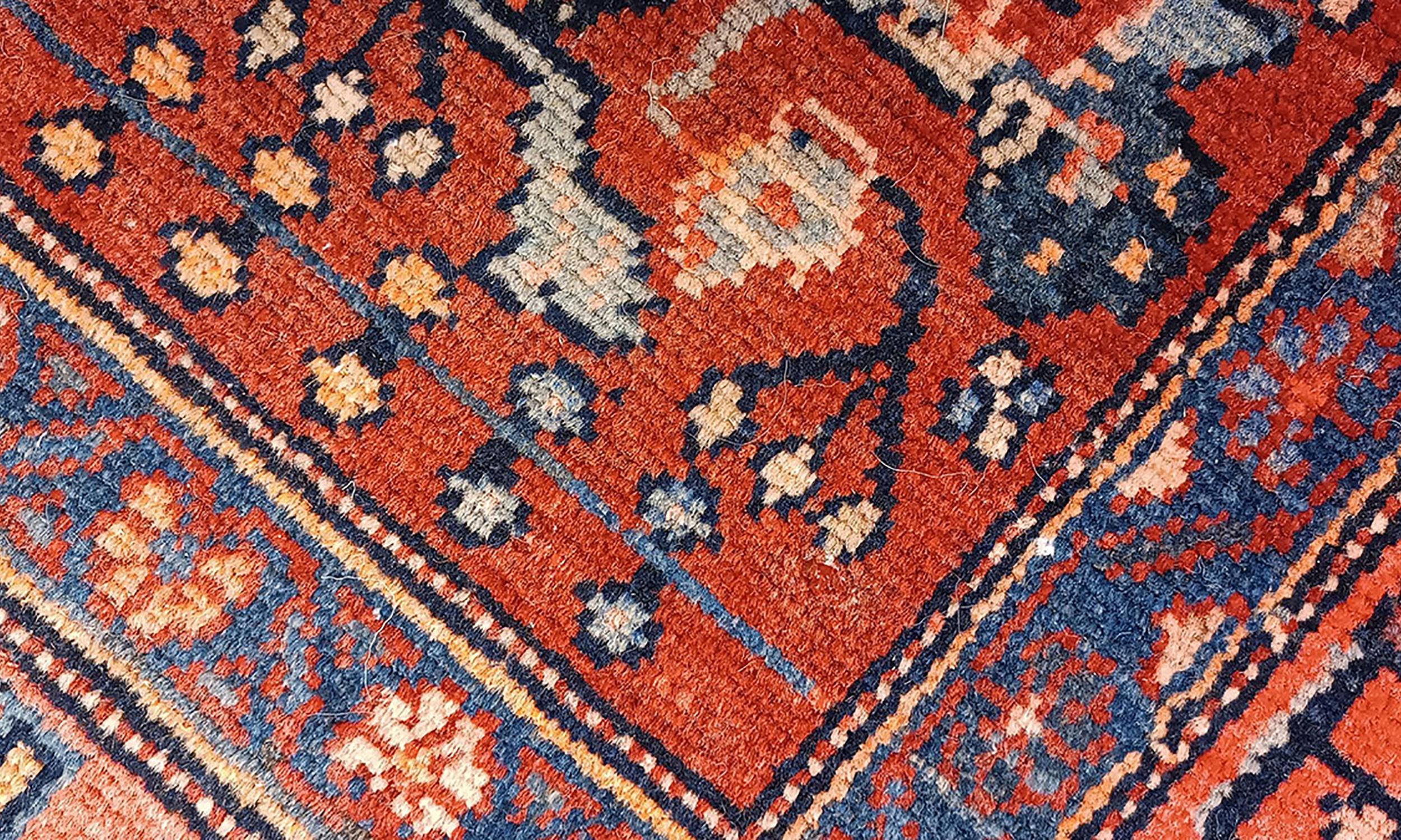Handmade carpet Oriental rug featuring a traditional floral pattern woven in deep rich tones created by organic vegetable dyes on lamb wool, this little mat is perfect for any modern or traditional home doorway. This semi-circle entranceway doormat