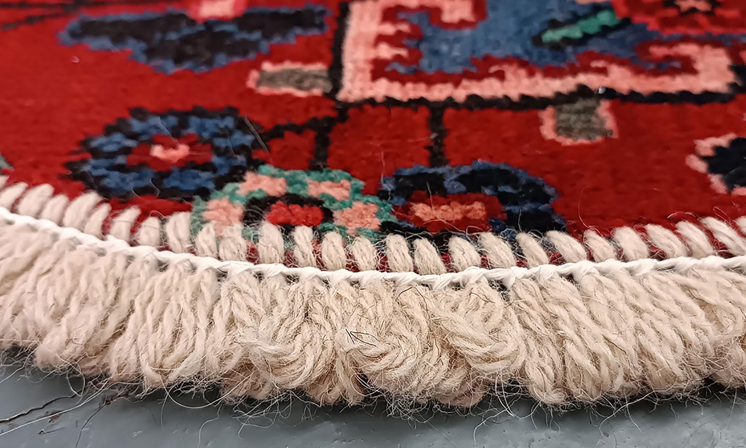 Handmade carpet Oriental rug featuring a traditional floral pattern woven in deep rich tones created by organic vegetable dyes on lamb wool, this little mat is perfect for any modern or traditional home doorway. This semi-circle entranceway doormat