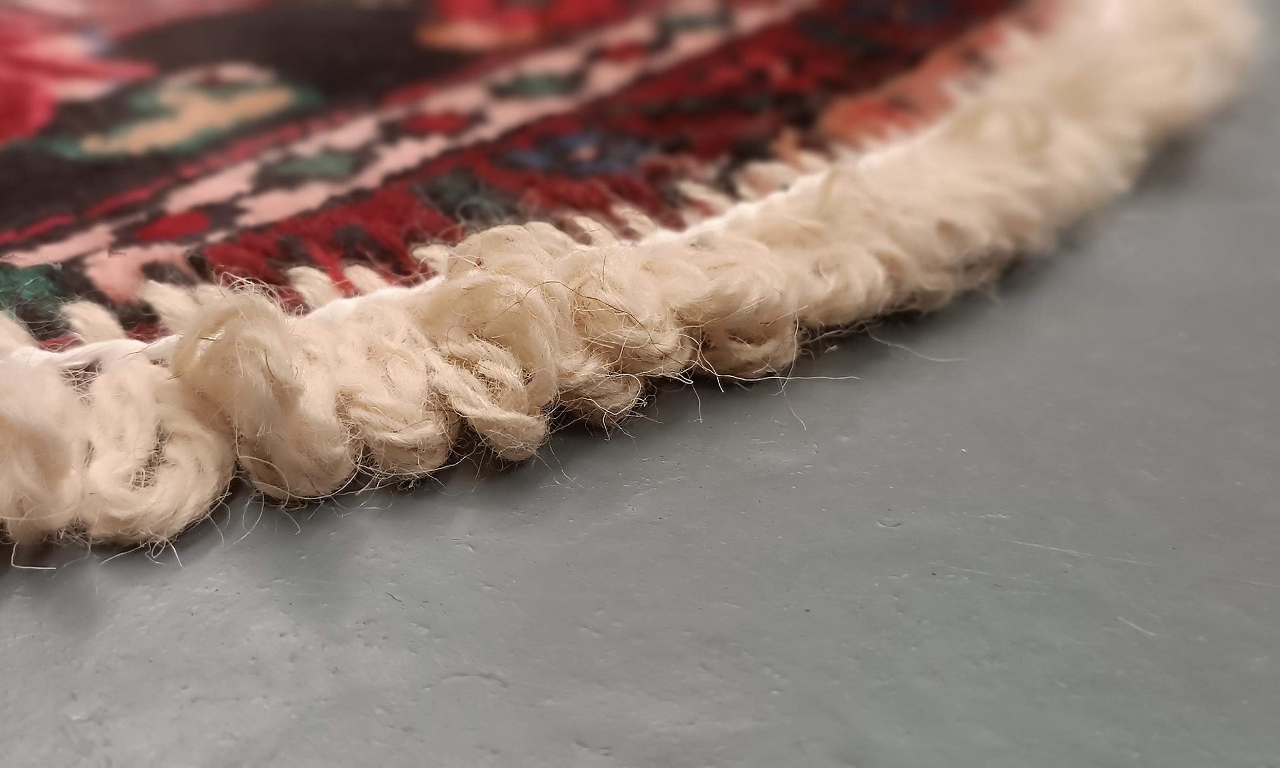 Handmade carpet Oriental rug featuring a traditional floral pattern woven in deep rich tones created by organic vegetable dyes on lamb wool, this little mat is perfect for any modern or traditional home doorway. This semi-circle entranceway doormat