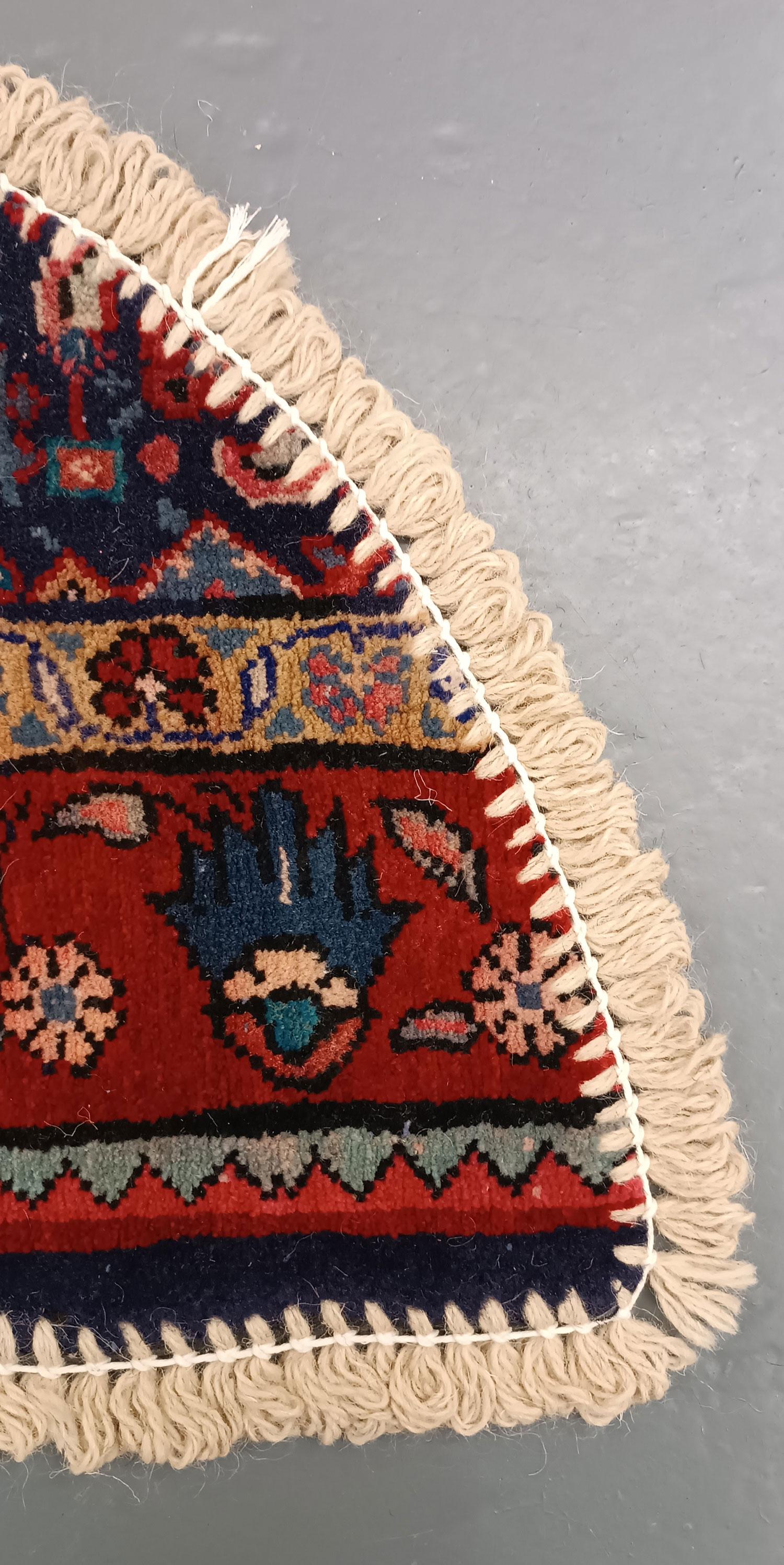 Handmade carpet Oriental rug featuring a traditional floral pattern woven in deep rich tones created by organic vegetable dyes on lamb wool, this little mat is perfect for any modern or traditional home doorway. This semi-circle entranceway doormat