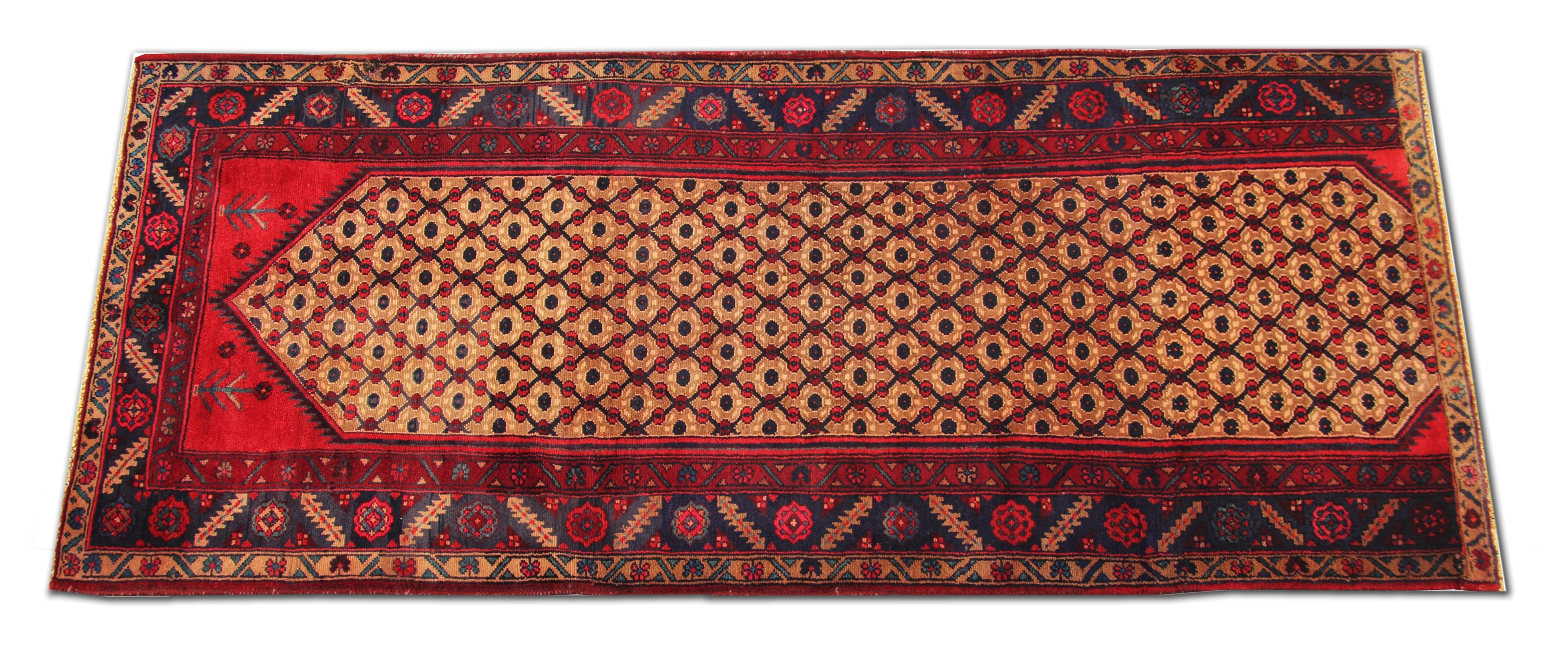This fine wool Runner rug is a great example of carpets woven by hand in the late 20th century. It features a bold design and colour palette, including red, blue and beige. The design and colour palette complement each other creating a beautiful
