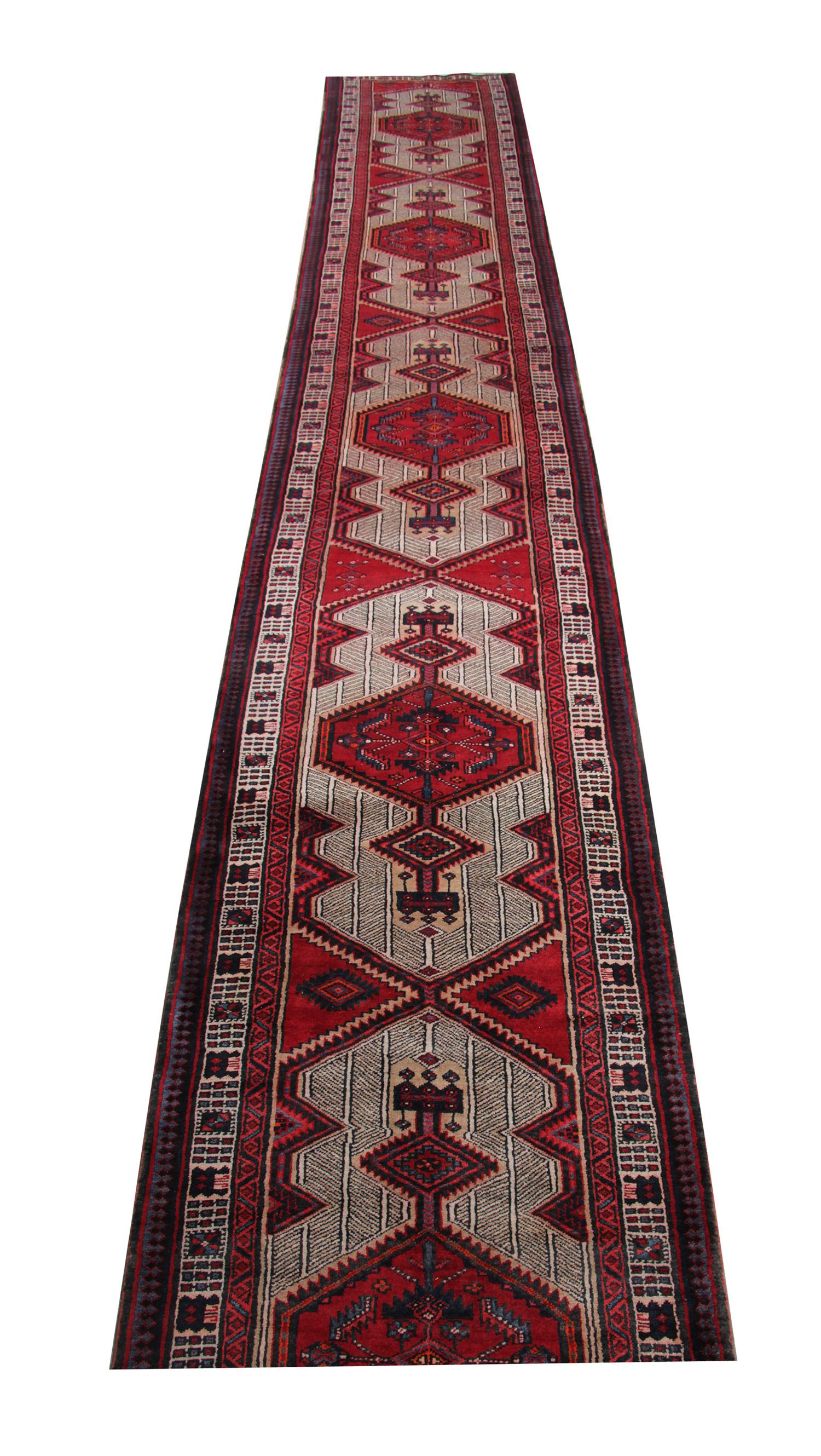 This fine wool runner rug was woven by hand and features a symmetrical repeat pattern design. Woven on a cream background with red accents. Intricately constructed with sophistication to create the perfect accent runner rug.
Constructed with the