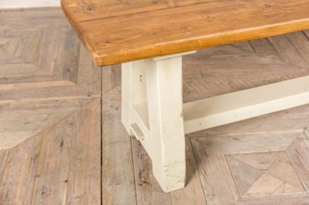 A fine handmade rustic pine bench with a-frame base, 20th century.

This rustic pine bench is ideal as an alternative to regular dining seating, it would complement kitchen dining tables in any setting. The bench has a hand-waxed rustic pine