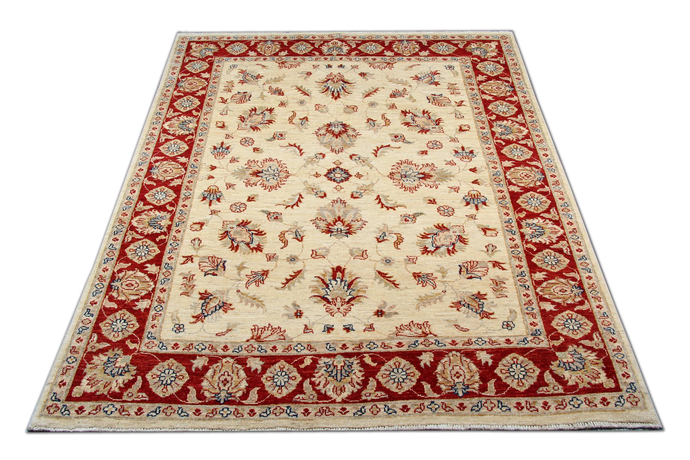 This traditional Ziegler rug is one of our more luxurious rugs made on looms by master weavers of Afghan rugs. This cream rug is made with or all handspun wool, with the color coming from organic vegetable dyes. This carpet features an all-over