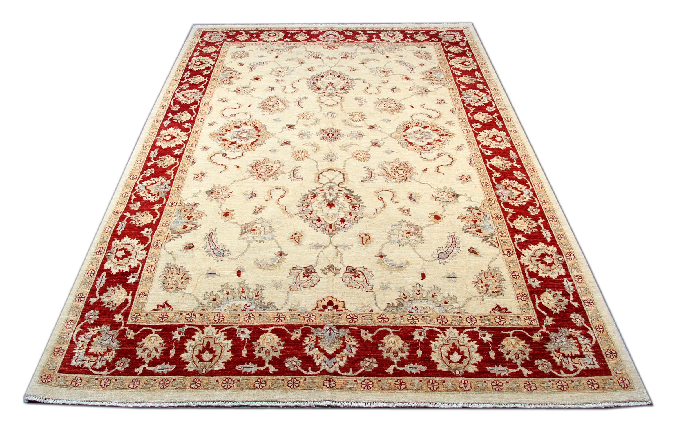 This traditional Ziegler rug is one of our more luxurious rugs made on looms by master weavers of Afghan rugs. This cream rug is made with or all handspun wool, with the color coming from organic vegetable dyes. This carpet features an all-over