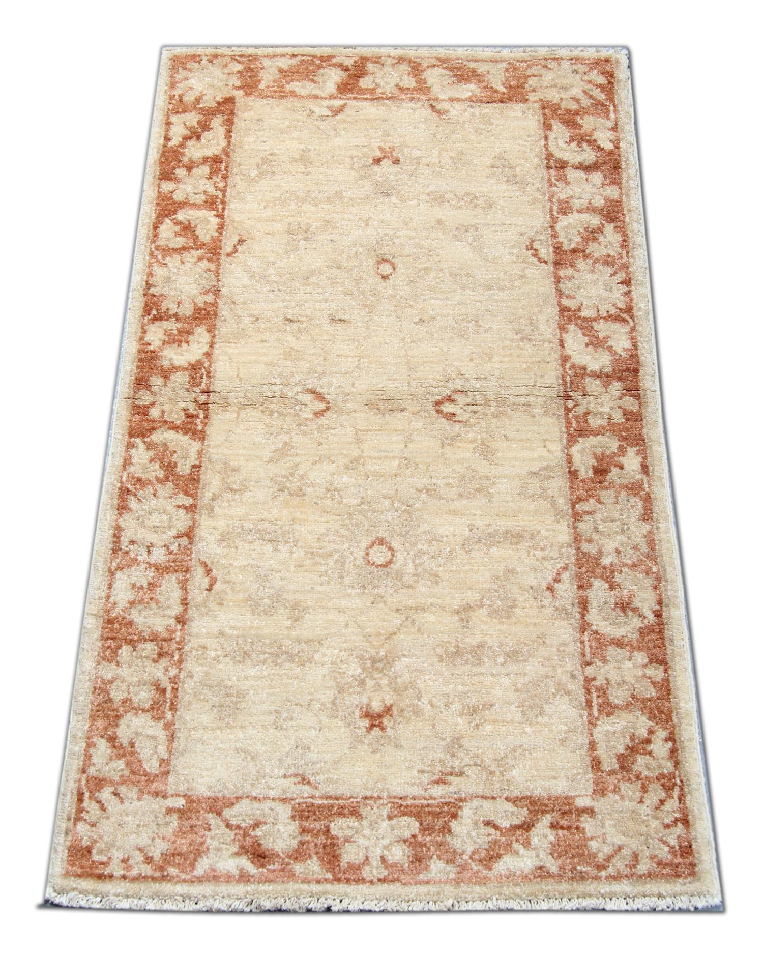This traditional Ziegler rug is one of our more luxurious rugs made on looms by master weavers of Afghan rugs. This cream rug is made with or all handspun wool, with the color coming from organic vegetable dyes. This carpet features an all-over