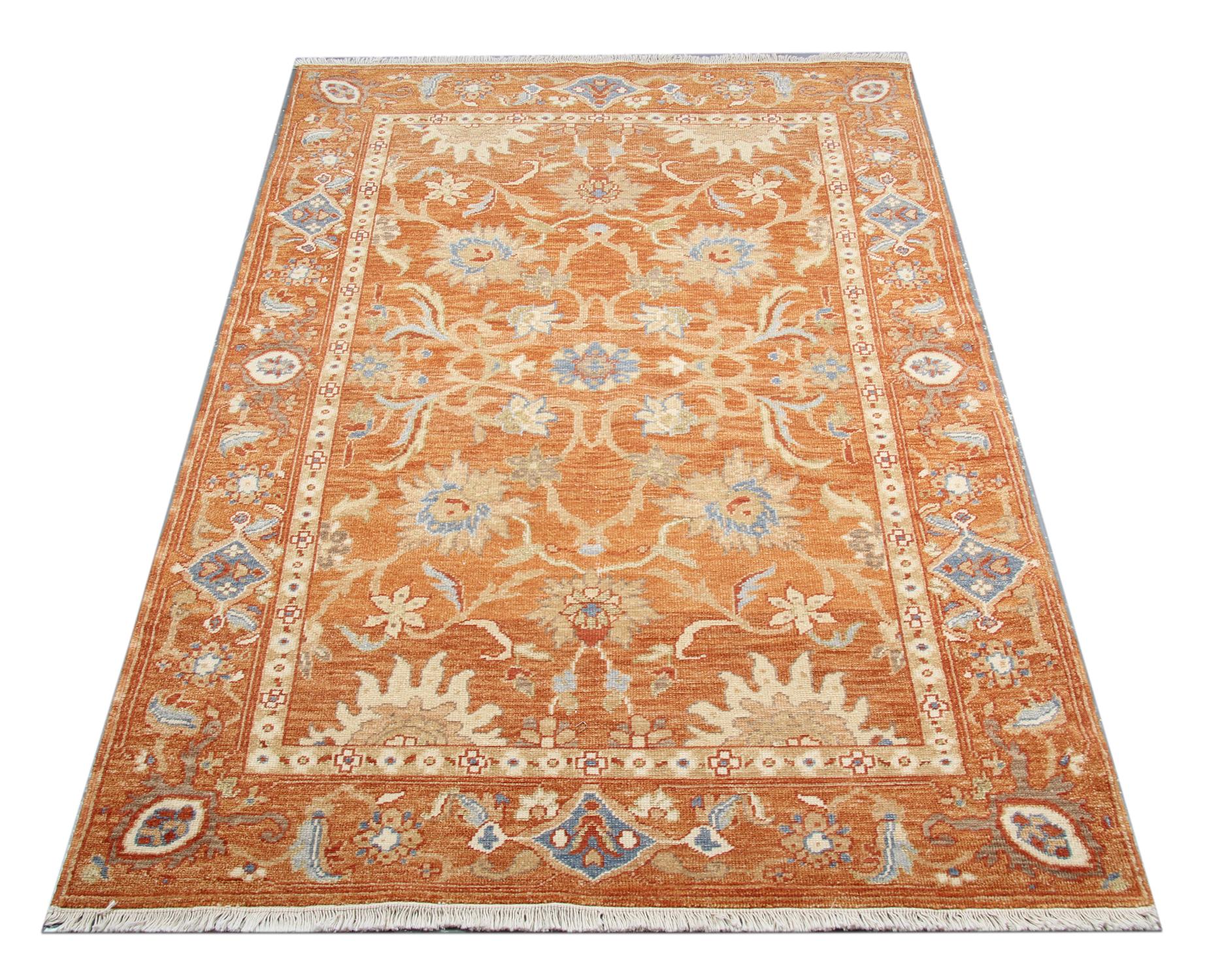 This traditional Ziegler style rug is one of our more luxurious rugs made on looms by master weavers of Afghan rugs. This cream rug is made with or all handspun wool, with the colour coming from organic vegetable dyes. This carpet features an