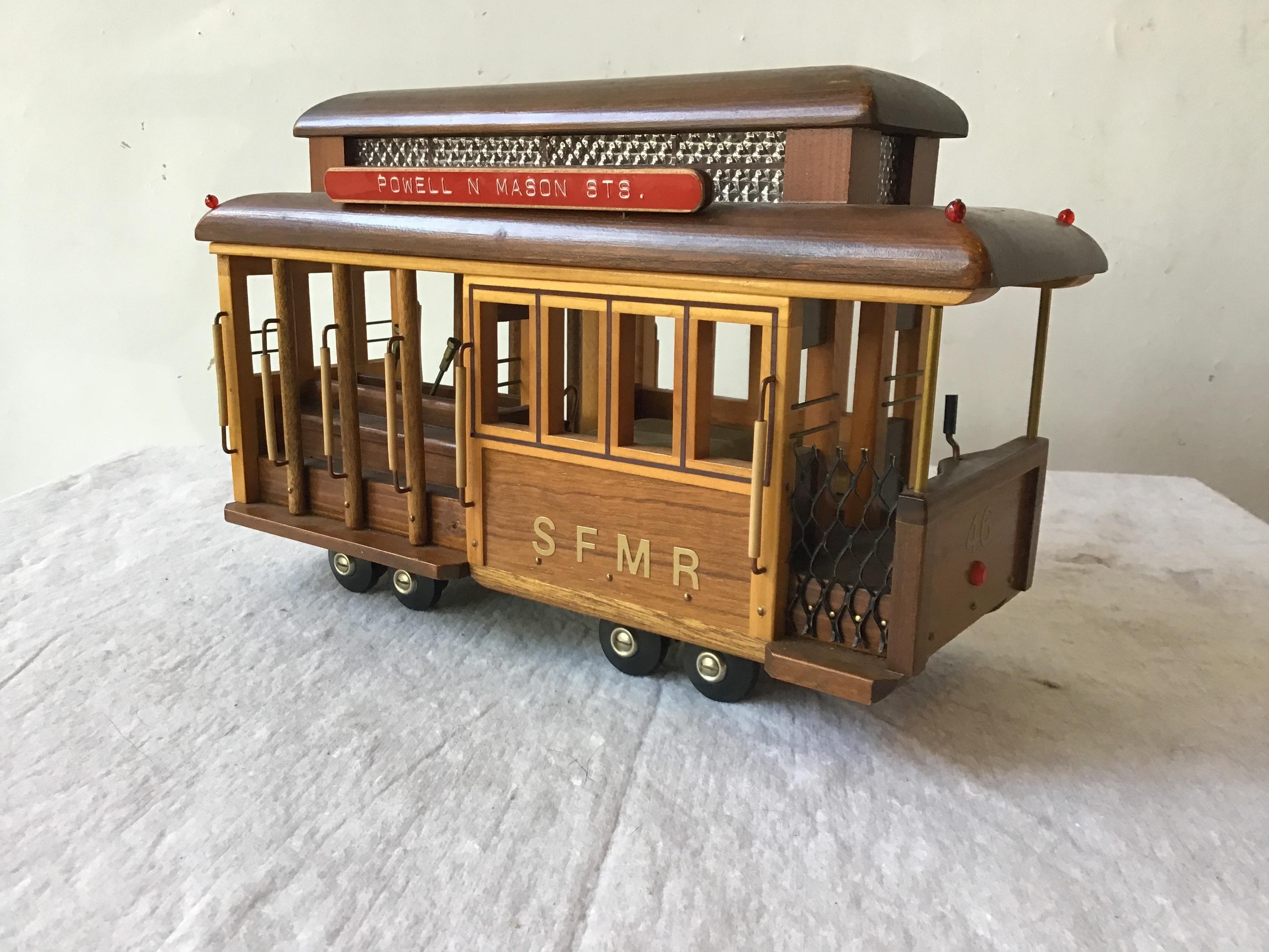 Handmade wood San Francisco street car by Nate Gruenberg in 1977. Swiss Reuge musical movement That plays I Left My Heart In San Francisco.