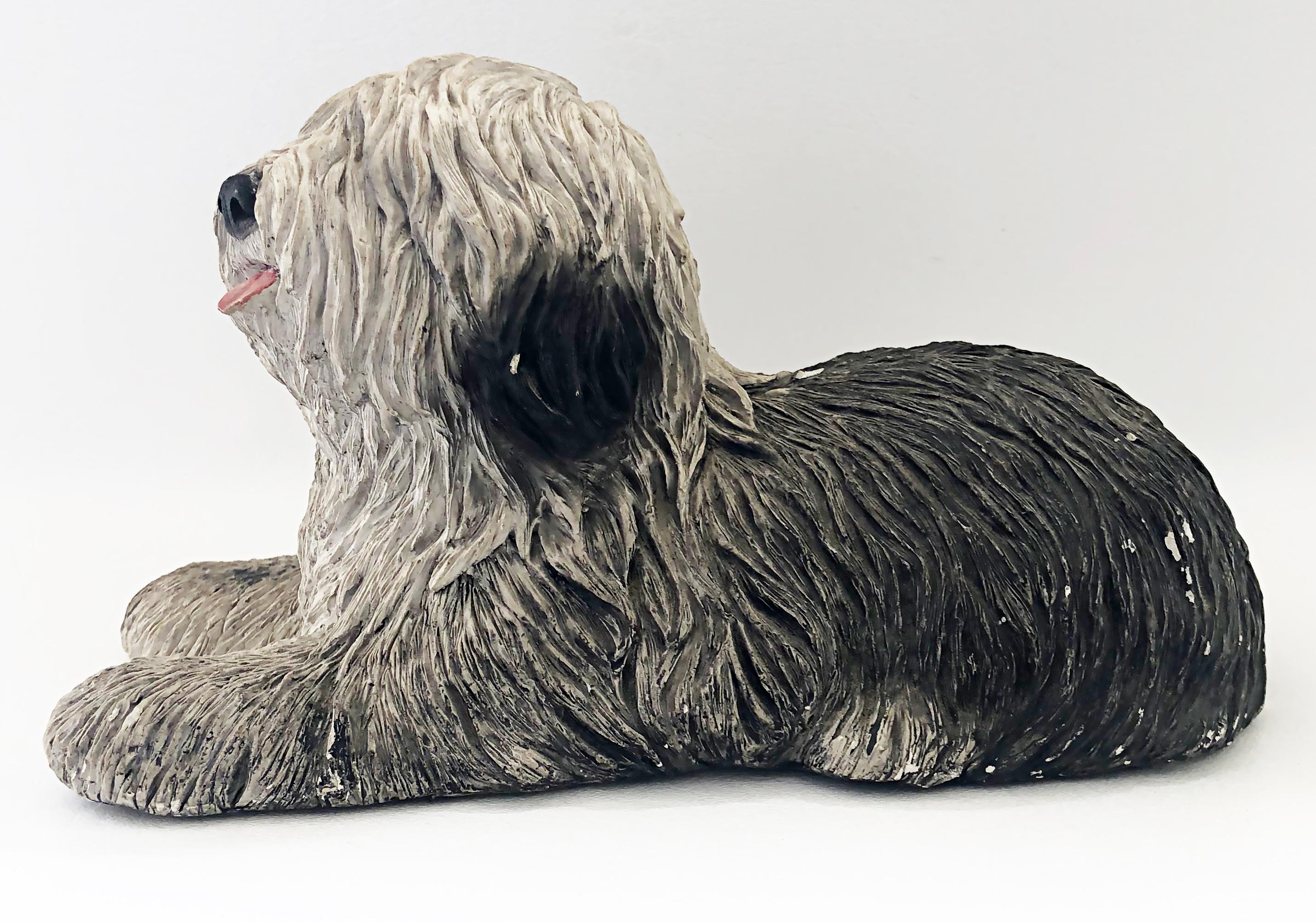 Handmade sandicast old english sheepdog sculpture, signed Sandra Brue, 1983.

Offered for sale is a hand-made sandicast sculpture of a shaggy black and white Sheepdog with an open mouth and tongue exposed. This piece is signed, copyrighted and