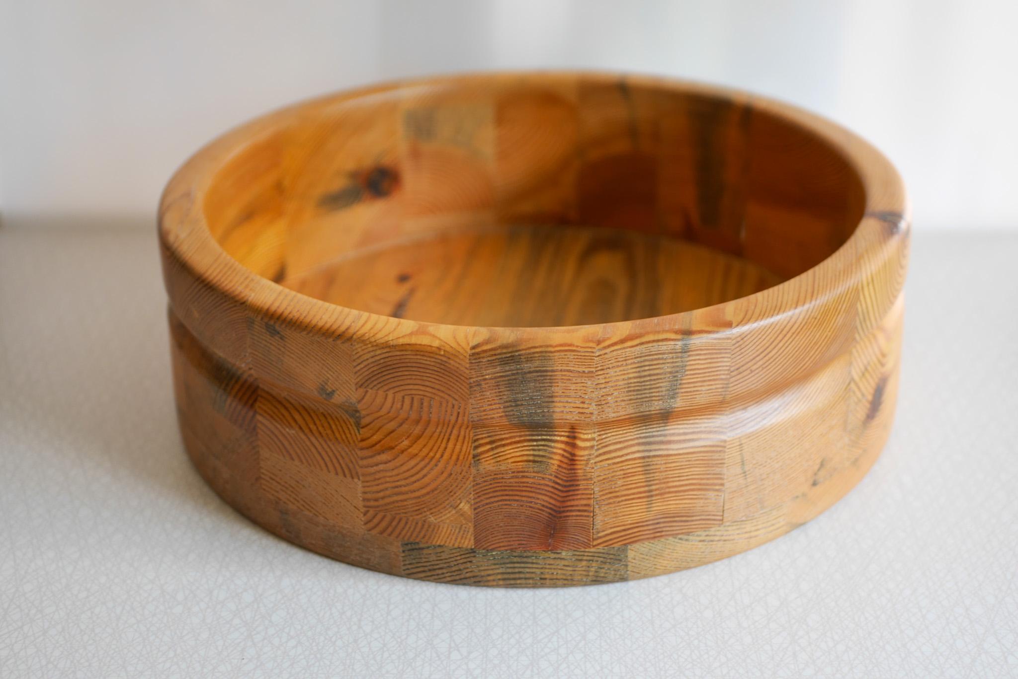 Rustic and  large handmade wooden bowl made from pine from Smålandsslöjd, Sweden. Designed by Stig Johnson who was famous for producing bowls, candlesticks and other decorative and practical items in heavy wood. This bowl can be used as a fruit bowl