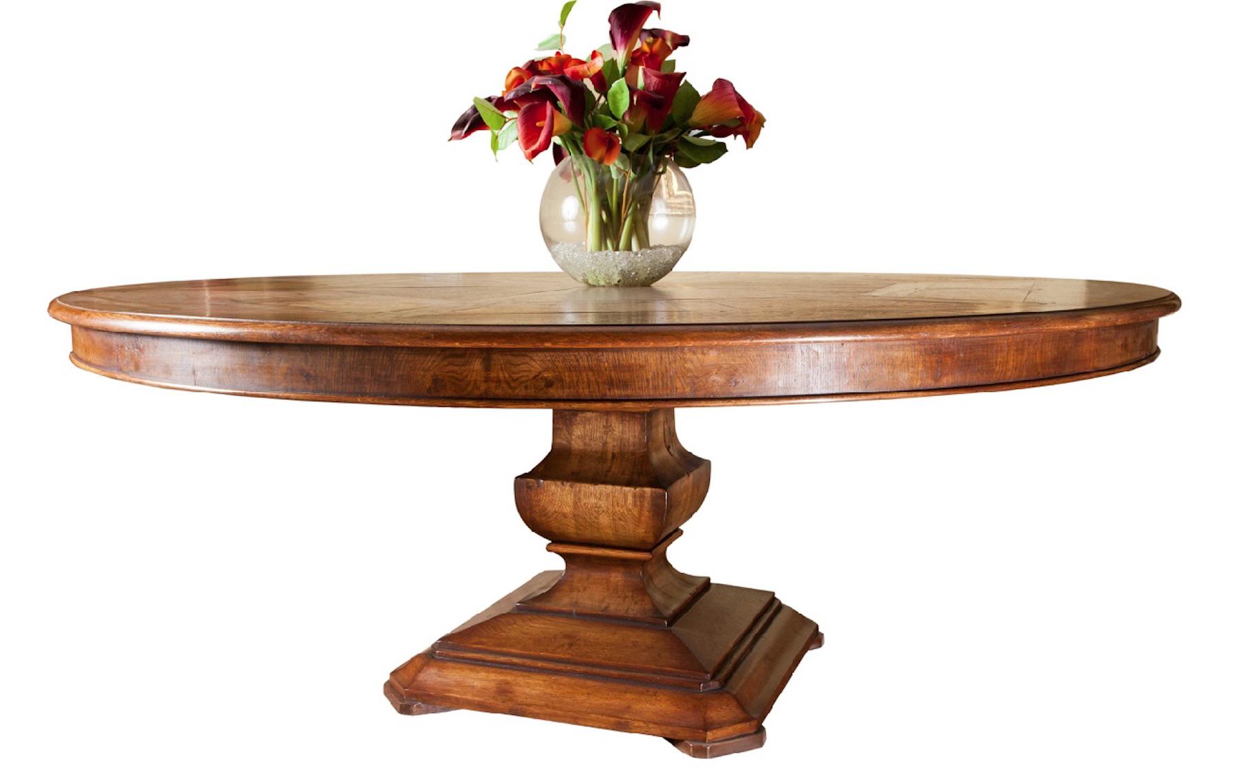 Handmade circular dining table, superb quality (made in the UK by Garners). The hexagonal segmented oak and burr oak panelled top sits on a contemporary platform column base. Seats 8/10. 

Drawing from our lengthy experience in antique and fine