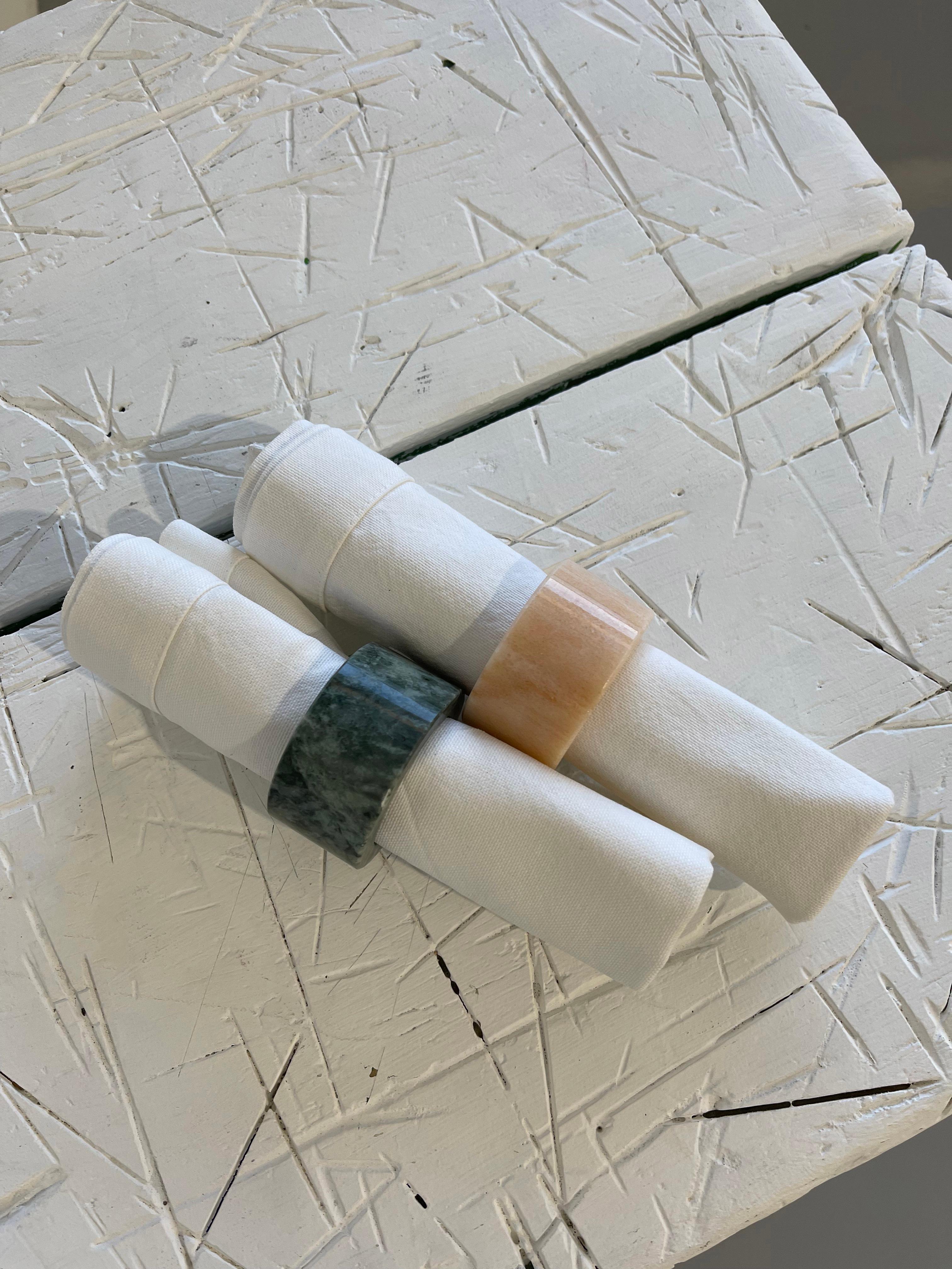 Set of two napkin rings in pink Portugal and green Guatemala marble with a rounded shape.
Each piece is in a way unique (since each marble block is different in veins and shades) and handcrafted in Italy. Slight variations in shape, color and size