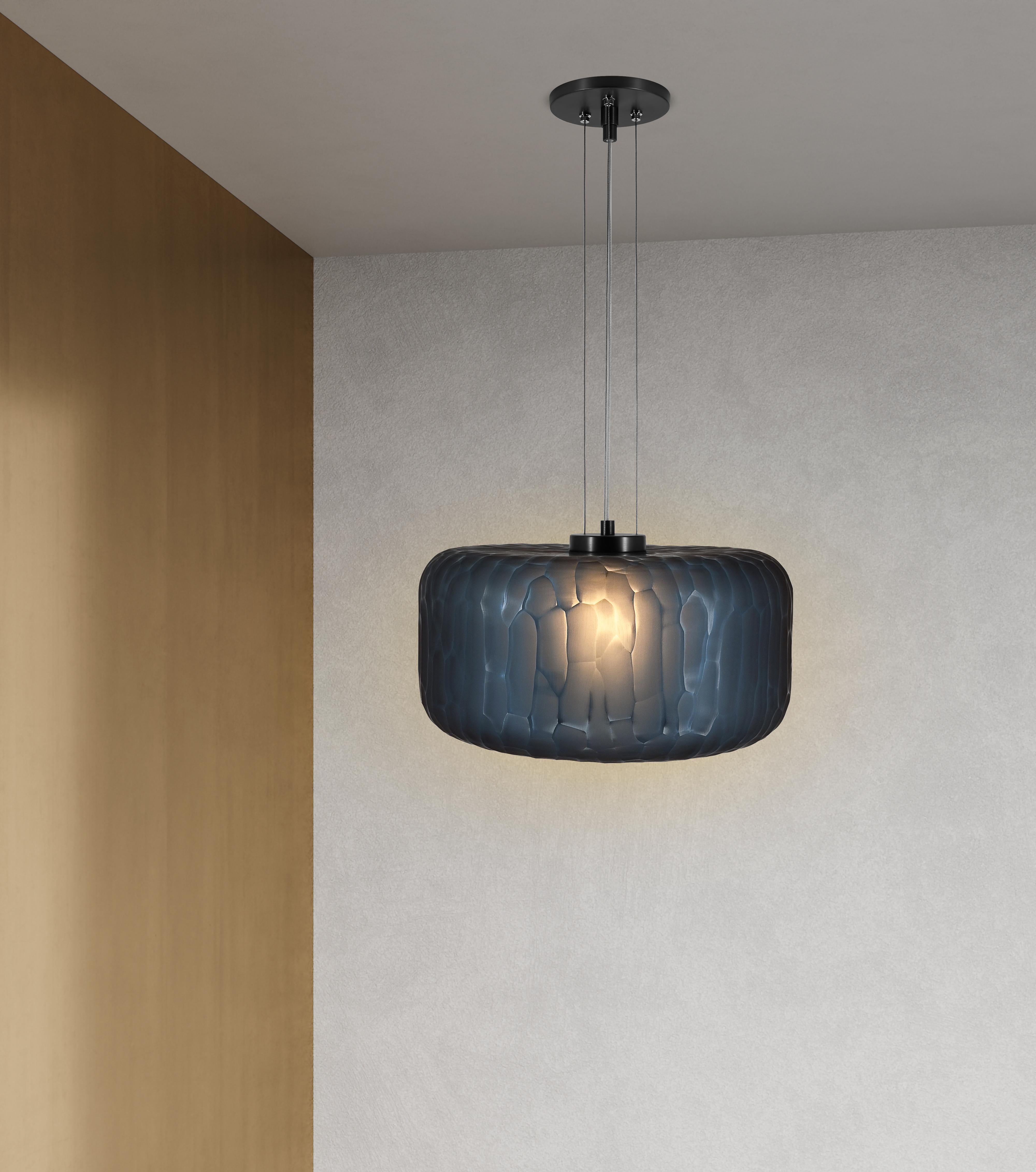 The Shereen Large pendant was designed with the expressive elegance of gemstone jewelry in mind. Bold, rounded contours with frosted, multifaceted surfaces create a remarkably exquisite sculptural piece with a rich, modern touch. Each piece is