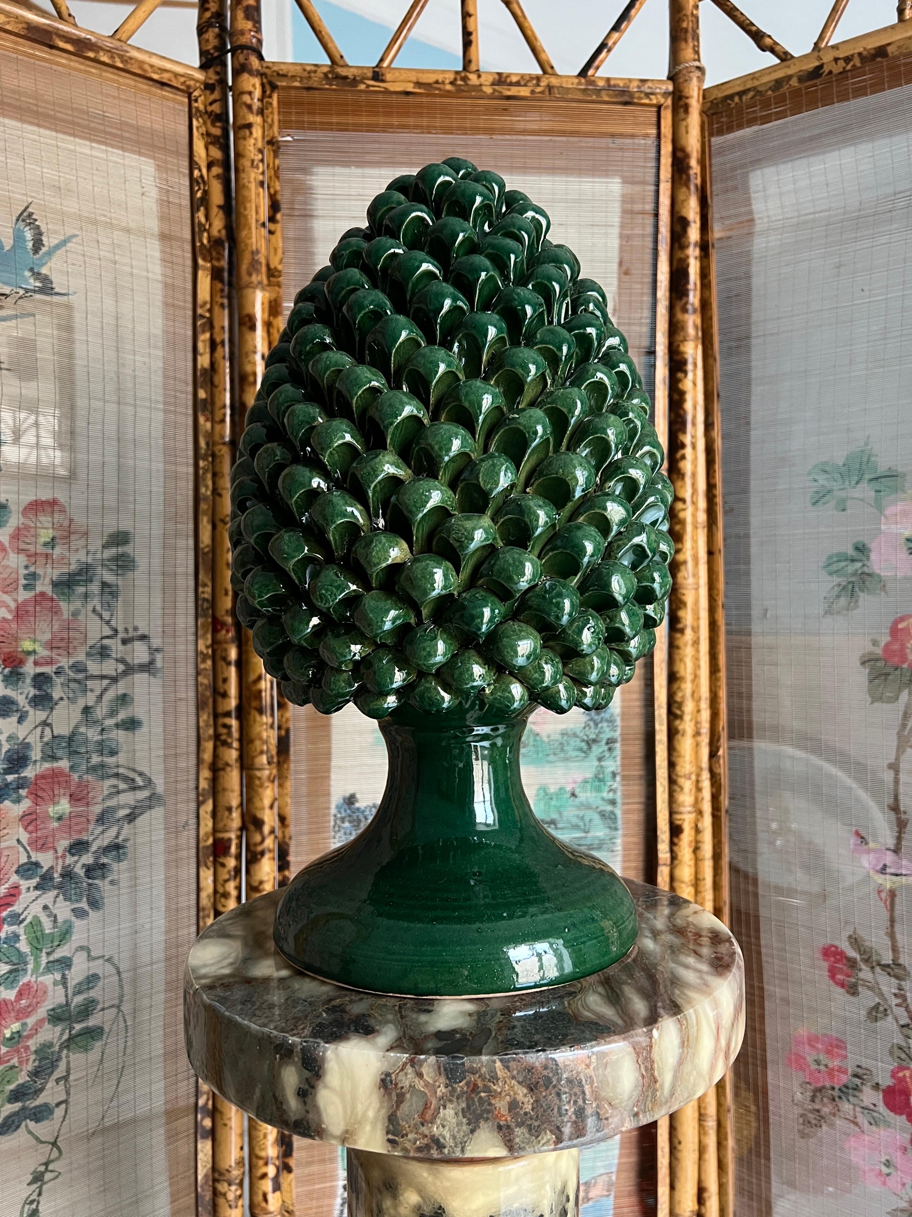 This exquisite handmade Sicilian ceramic pine nut is a timeless symbol of prosperity, good fortune, and Mediterranean heritage. Crafted by skilled artisans in Sicily, each piece is meticulously shaped and glazed, showcasing the region’s rich ceramic