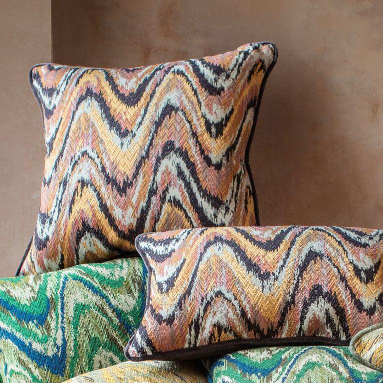 Handmade in its entirety, Beaumont & Fletcher's Kyma pillow has a striking flame stitch front and plain silk velvet back and piping. This particular design combines playful pinks with rich golden hues and the deepest colour of purple. 

It has an