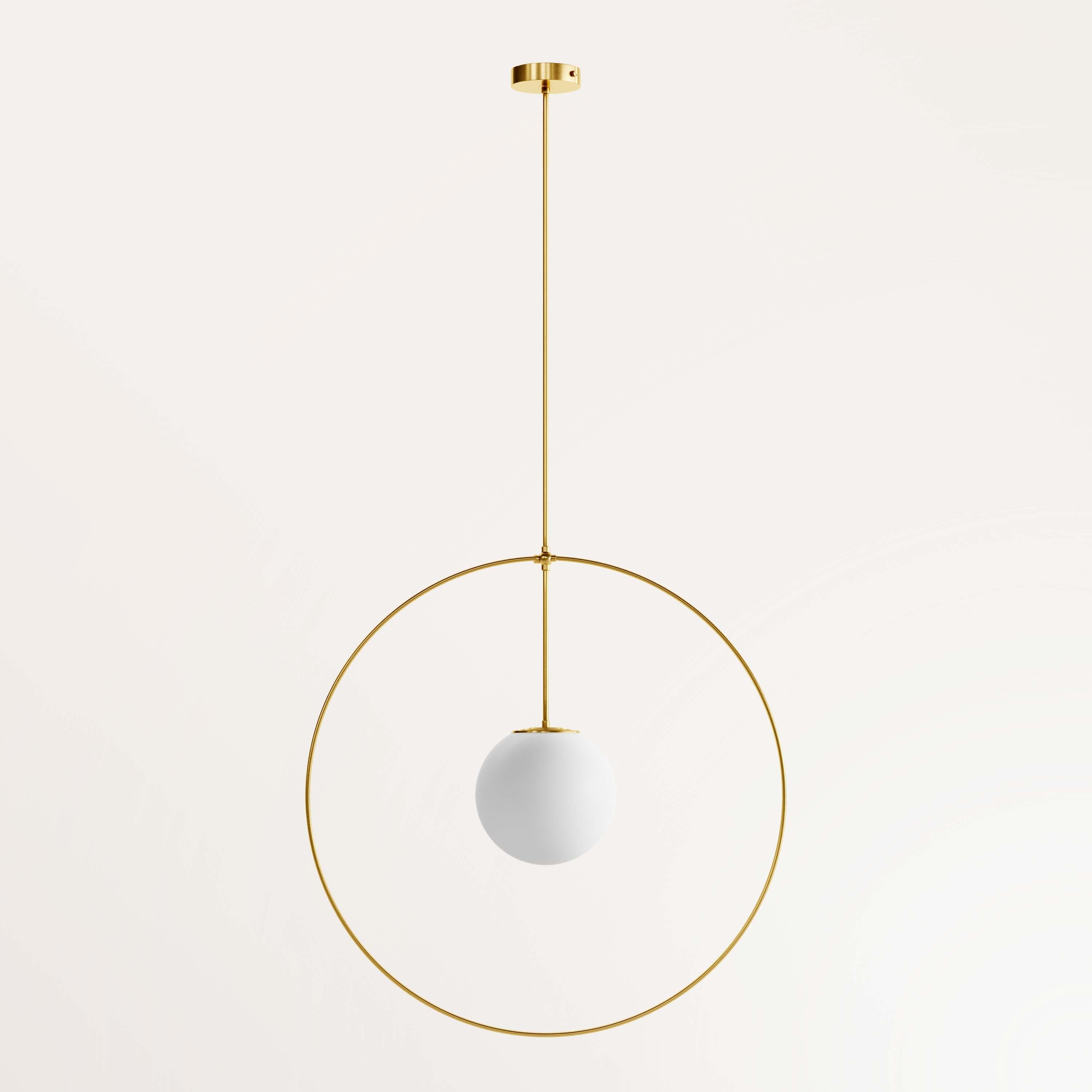 Handmade small helios chandelier by Gobo Lights
Dimensions: globe Ø 15 ; Ø 45 ; 100 H 
Materials: Brass, opaline

Goddess with three light heads 

Self-taught and from the world of chemistry, this Belgian craftsman / designer designs his