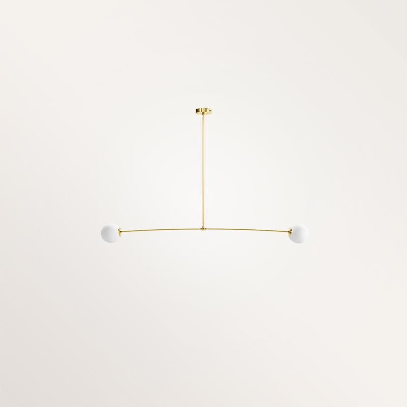 Handmade small Nemesis I chandelier by Gobo Lights
Dimensions: 100 L x 12 l x 100 H
Materials: Brass, opaline

Nemesis is the Greek Goddess of fair anger, revenge and balance which has inspired this light. 

Self-taught and from the world of