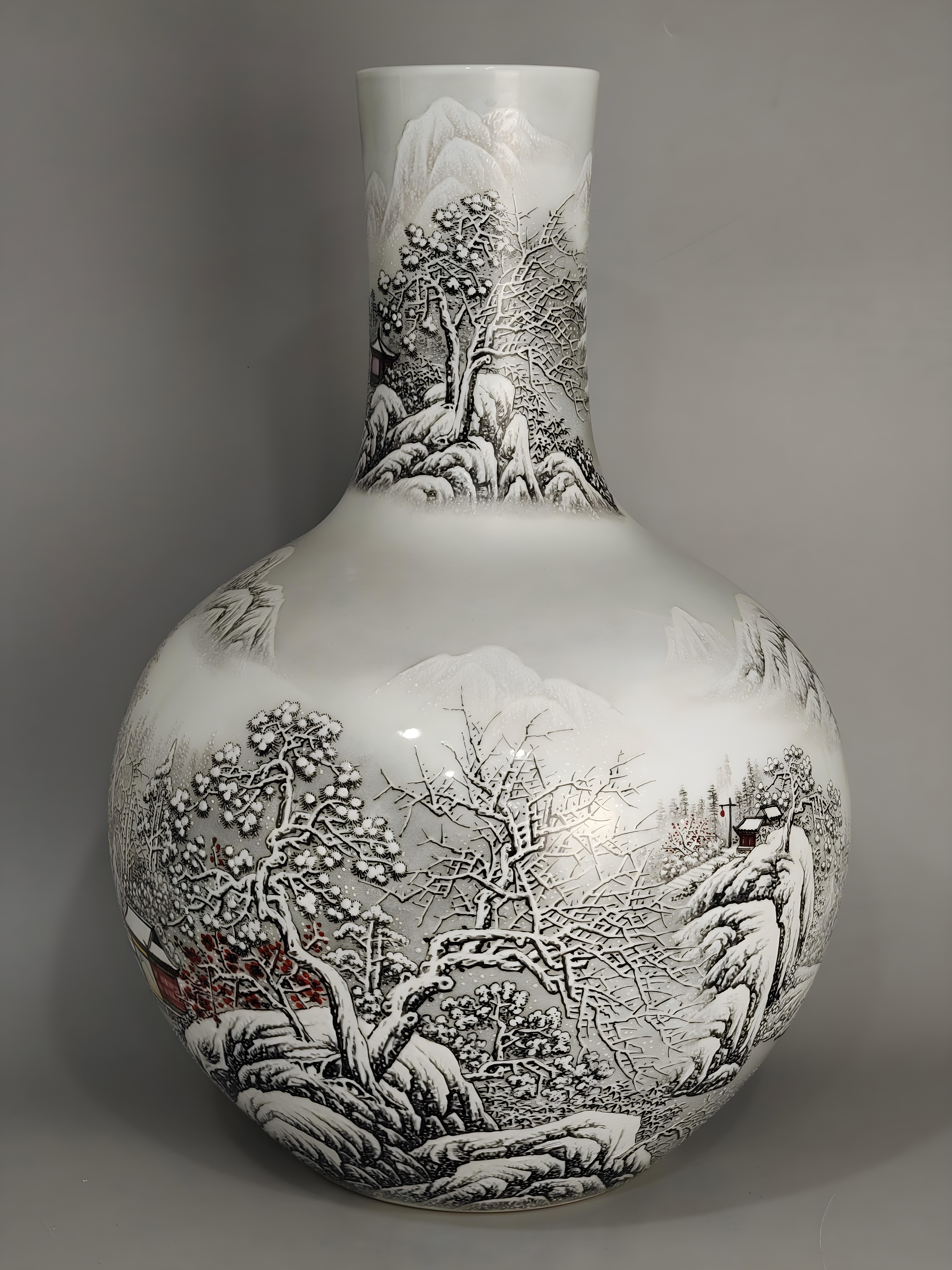 A Handmade Snowing Landscape Porcelain Vase from China, specifically Jingdezhen, refers to a vase crafted in Jingdezhen, a renowned center for porcelain production in China. This vase features a snowing landscape design, showcasing a winter scene on