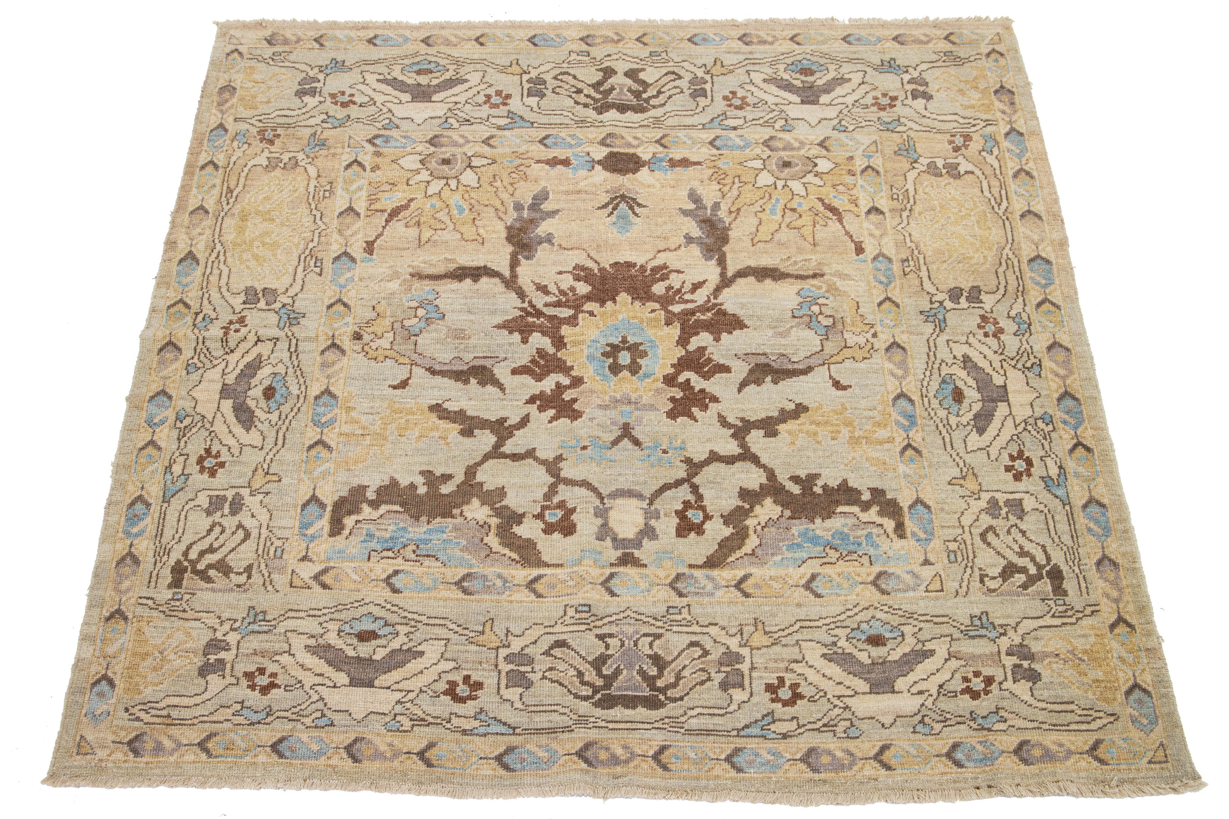 This is a hand-knotted Persian wool rug with a beige field. The design has accents in brown, blue, and goldenrod.

This rug measures at 6'2