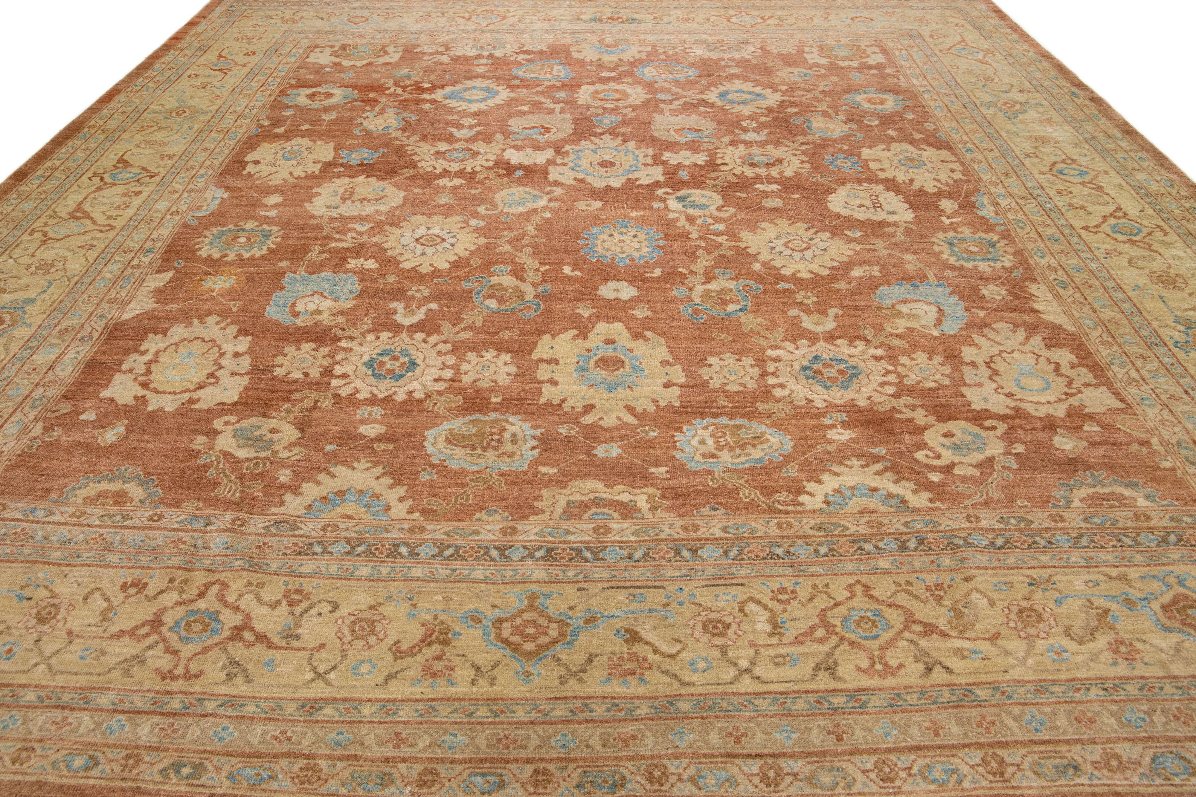 Modern Sultanabad design is flawlessly embodied in a meticulously handcrafted wool rug, displaying an impressive brown hue that captivates the eye. A meticulous border gracefully outlines the intricate floral stitching that adorns the entire rug,
