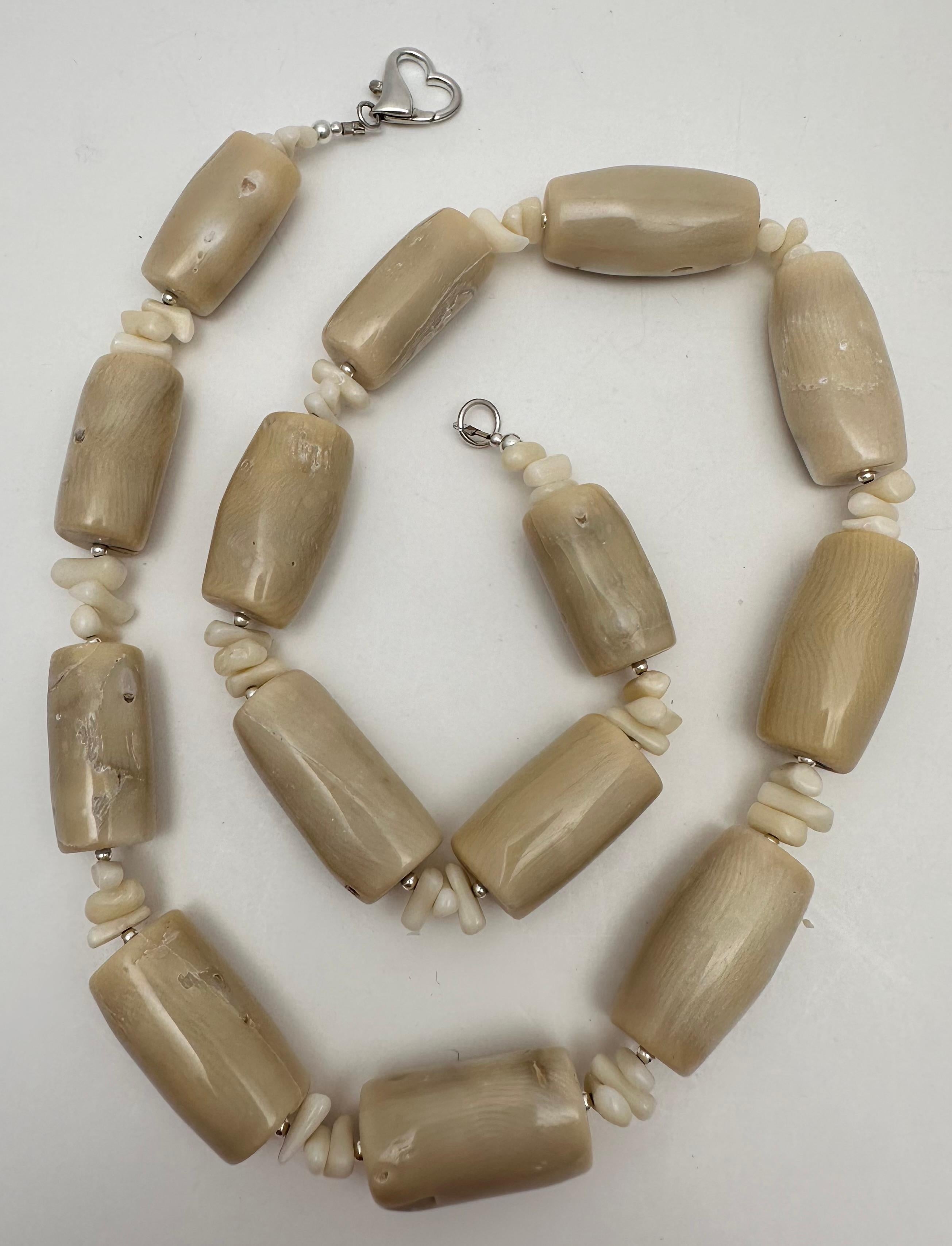 Upgrade your jewelry collection with this stunning Handmade Sterling Silver Beige Barrel Coral Beaded Necklace. The 26-inch necklace is beautifully crafted with a heart shape lobster clasp and features a barrel-shaped coral stone as the main