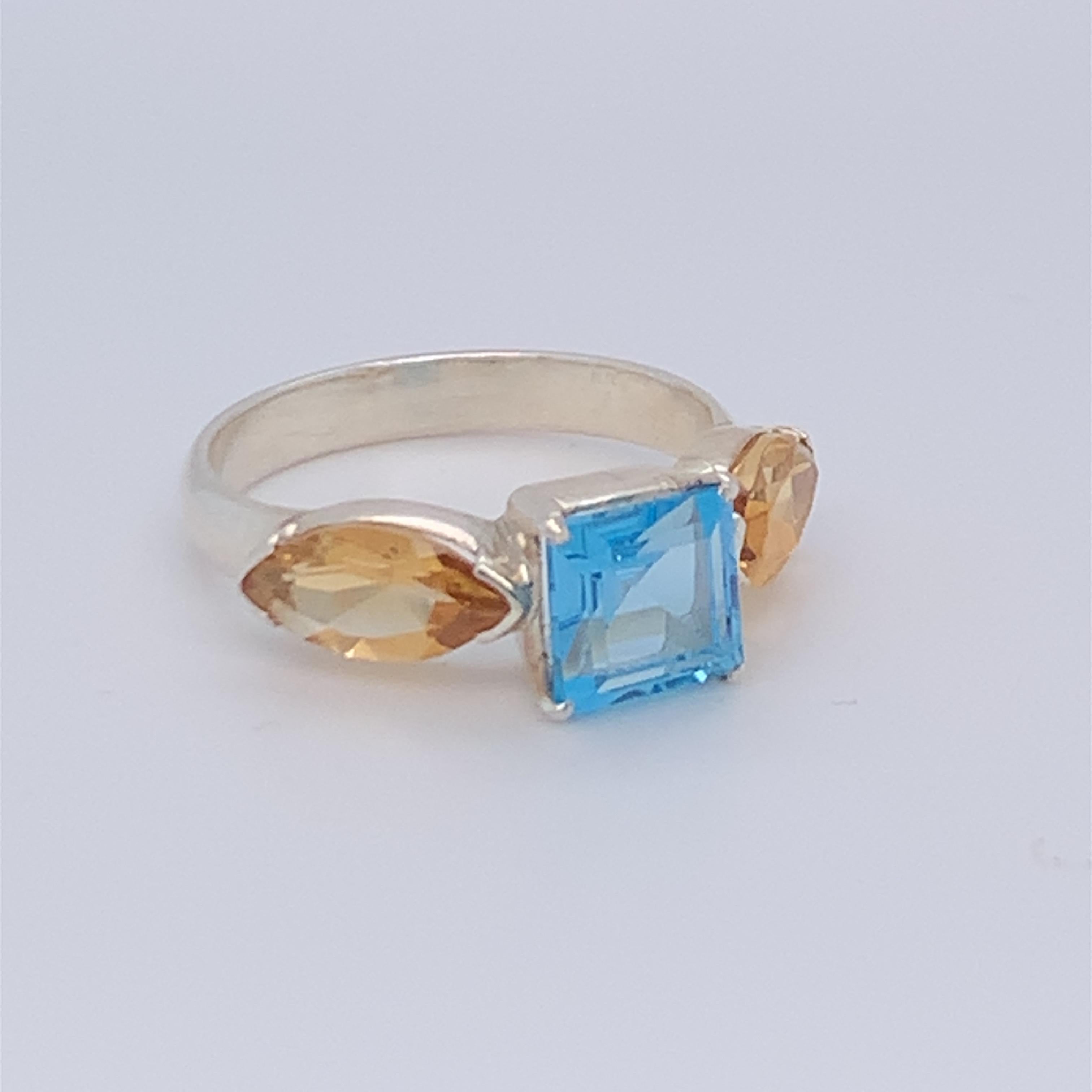 This beautiful square blue topaz ring boasts two marquise citrine on each side. It is simple, plain and suitable for day wear. Set in sterling silver and hand made by master craftsman.

Total weight of stone: 2.90ct (approximate)
Size: 8