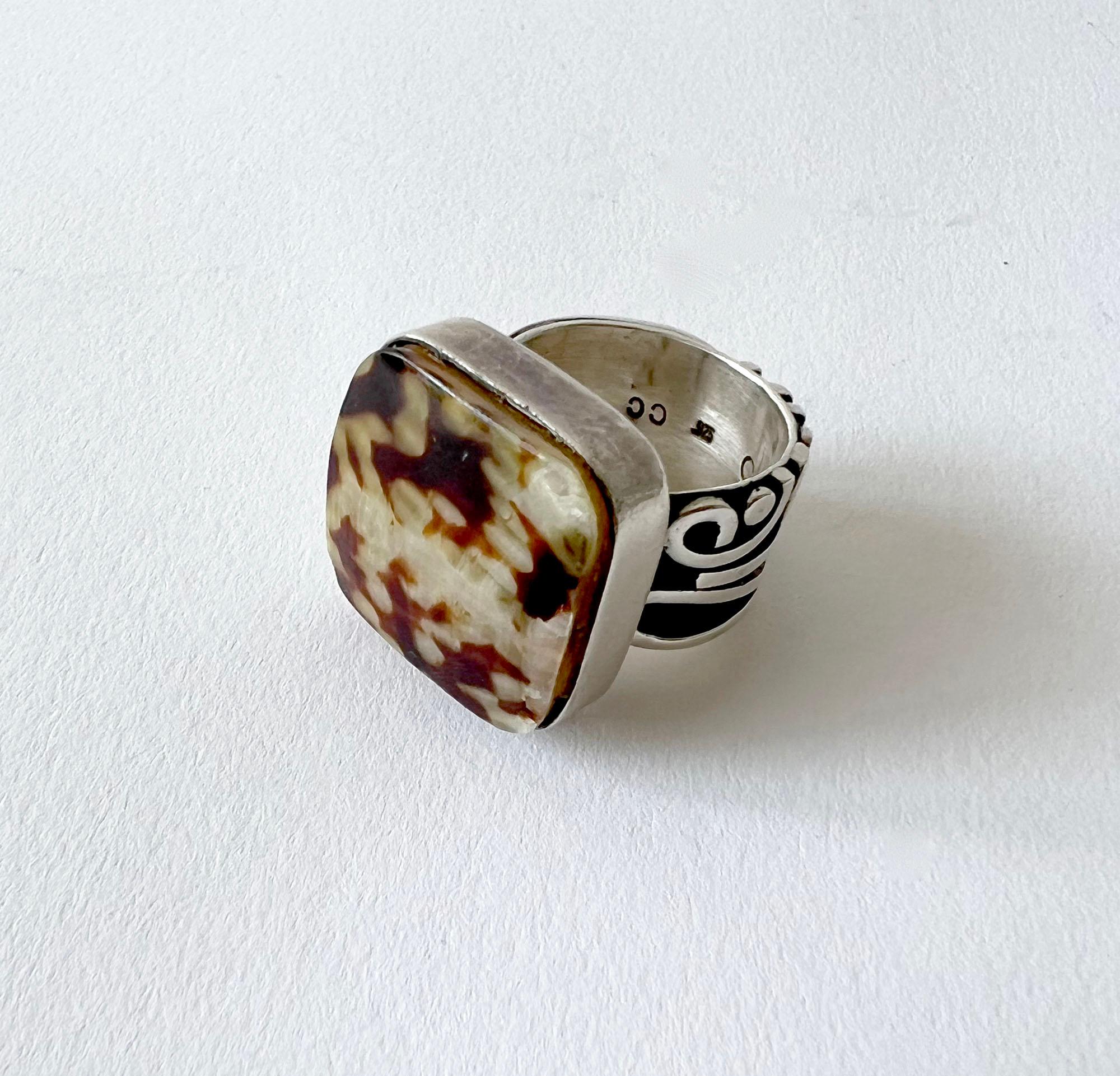 Handmade sterling silver modernist ring with natural flat, square stone or shell, suitable for a man or woman.  Ring is a finger size 9.  In  good vintage 1980s condition with some wear to the side of the stone.  Unknown maker.