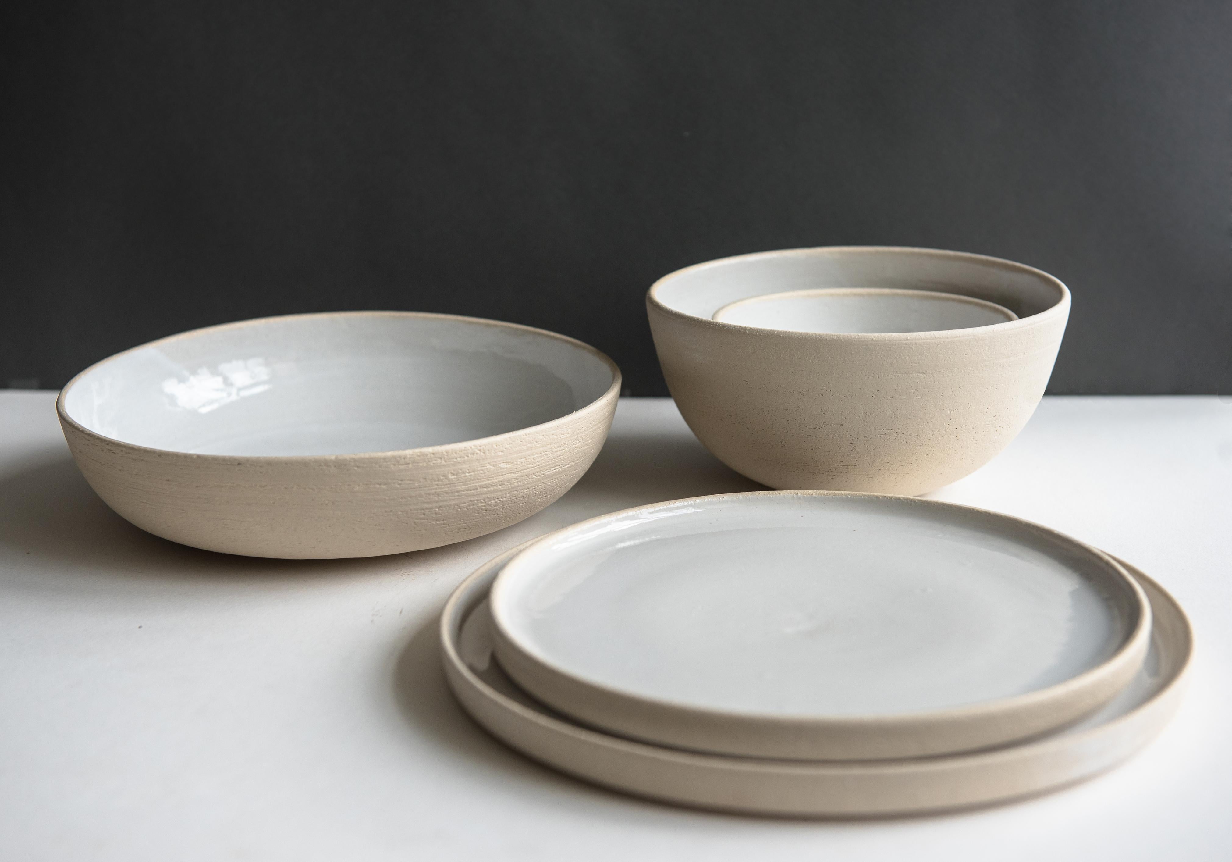This is the most honest ceramic ware we have ever produced - exposed rough stoneware shows occasional signs of the artisans' fingers that were left during the hand-throwing process. The sides were smoothed but one can still see stoneware pores as if