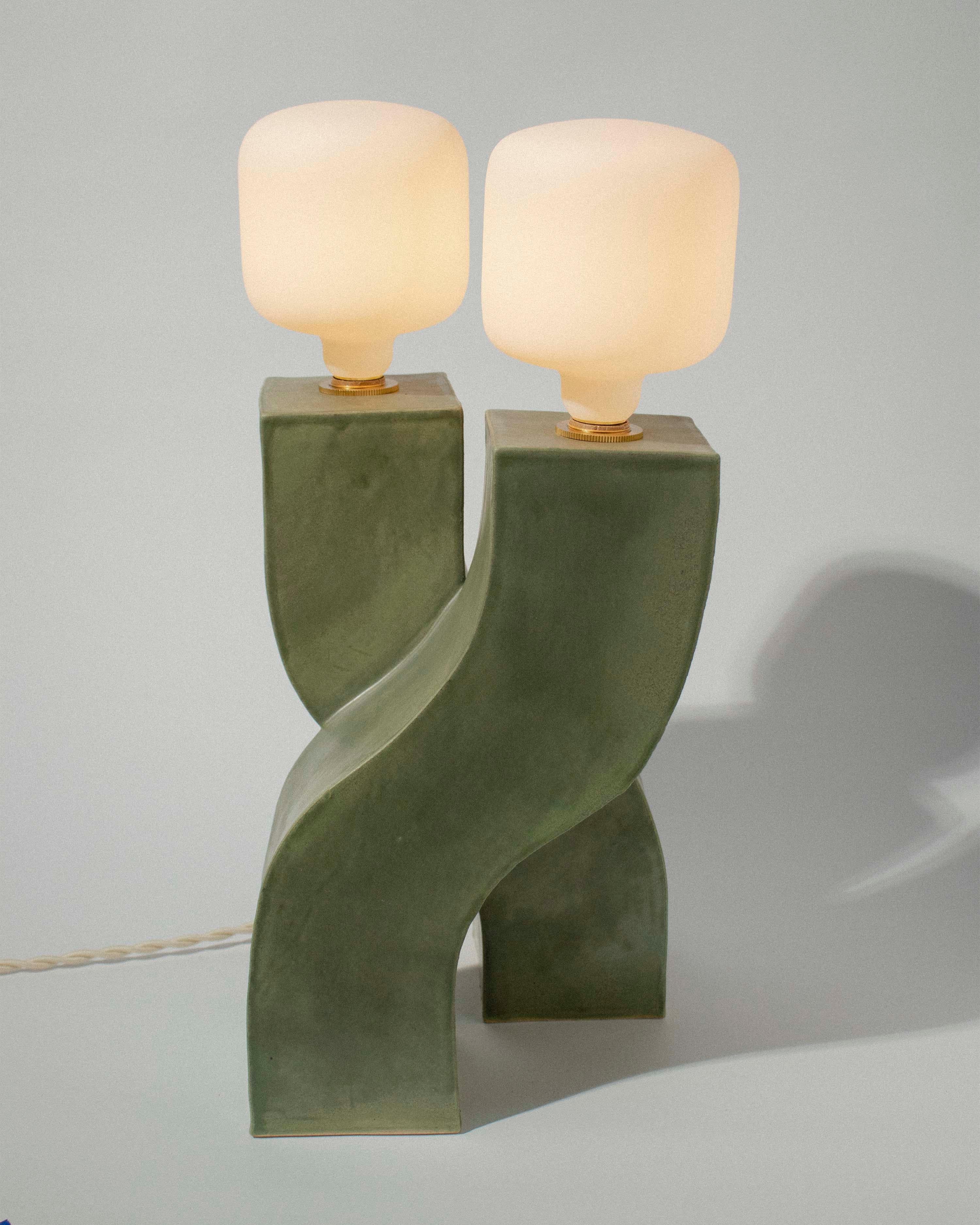 Created by Ethan Streicher, founder of Streicher Goods, located in Brooklyn, NY. 
Each Helix lamp is hand-built using stoneware and slab building methods. 

The Helix lamp is comprised and supported by two elegantly conjoined S-shaped pieces,