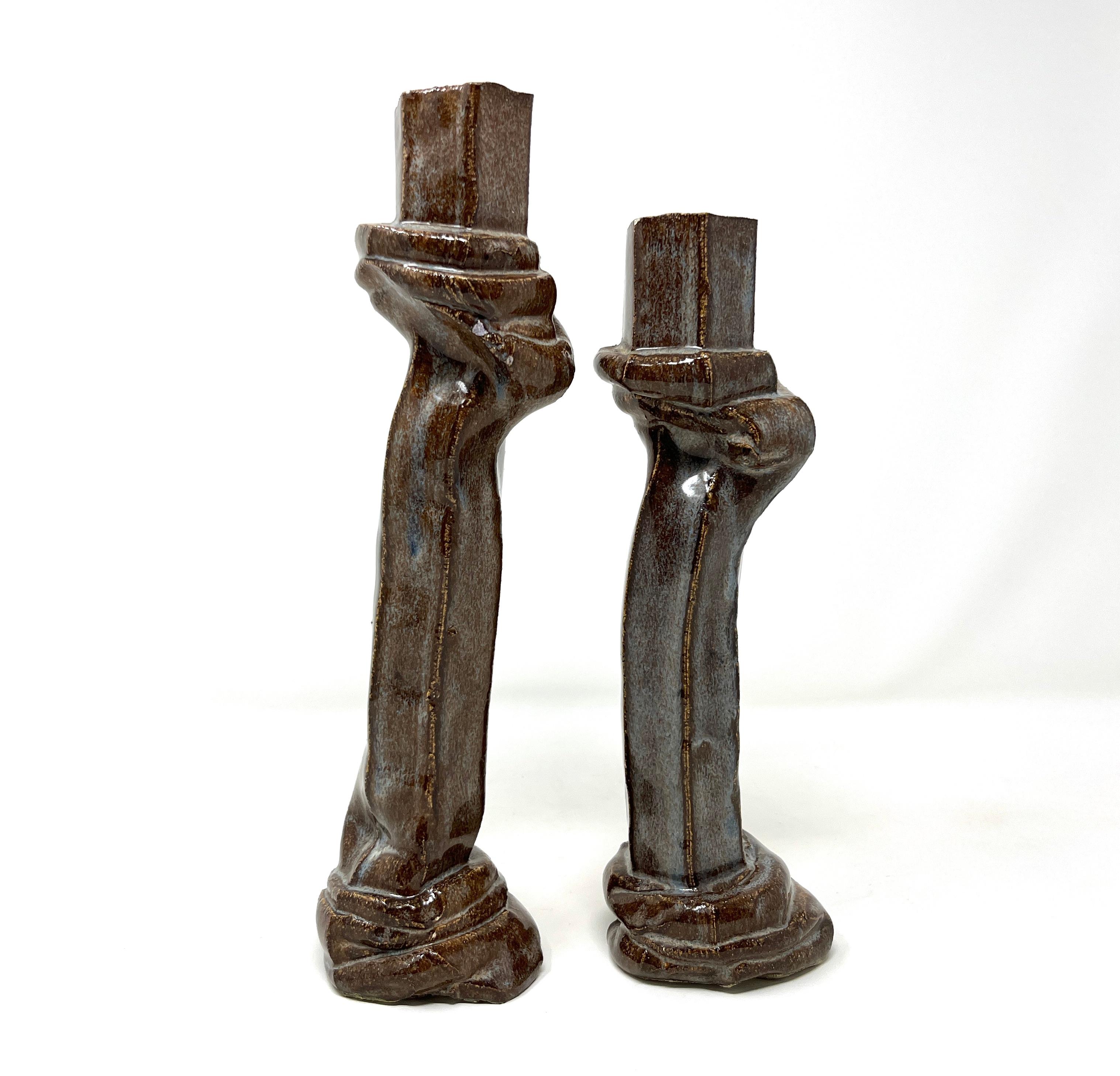 Handmade pair Bohemian style ceramic candlesticks with gorgeous brown and blue slightly iridescent glaze. One of a kind, they are slightly mismatched, with one a touch shorter. Beautiful statement piece for a glamorous table setting. Probably made