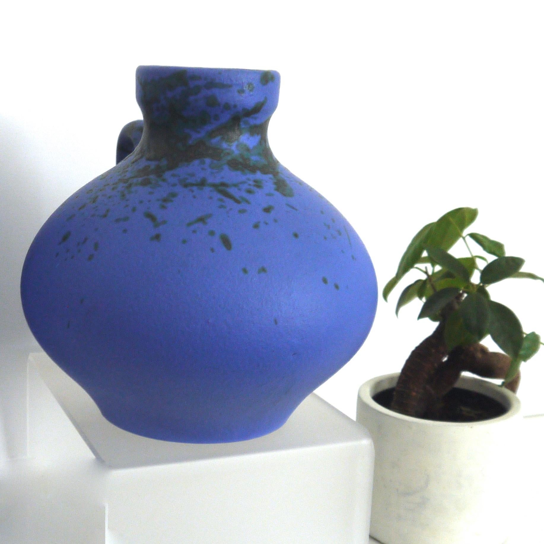 Hoy Hartwig vase and pitcher

Handmade studio vase by Pottery Hartwig Heyne also known as Hoy Pottery. Vintage midcentury Studio Pottery 1960s. Unica with signature. German ceramics at Oer-Erkenschwick near Gelsenkirchen, closed its doors at