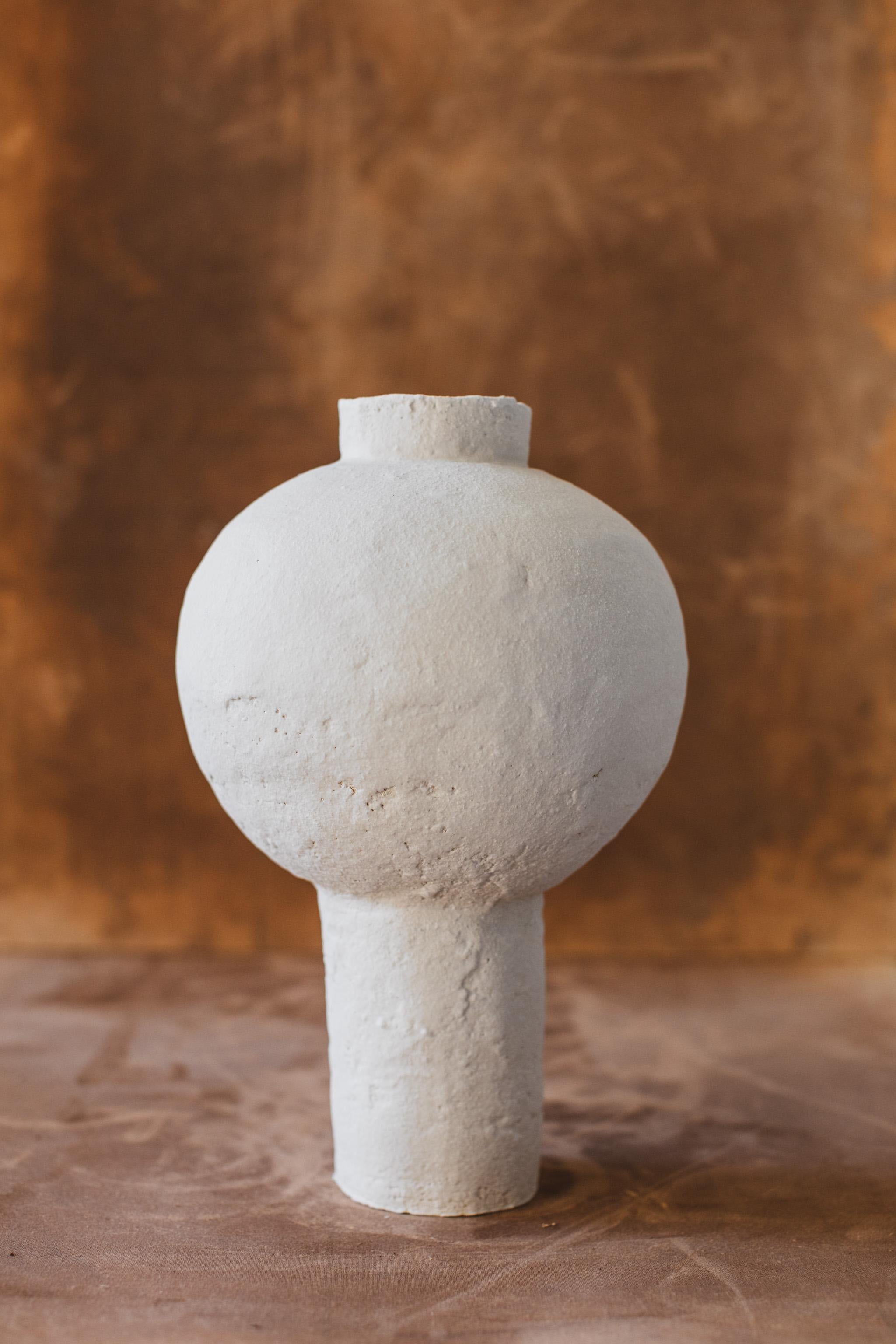 Mugly NYC is a Brooklyn based ceramic studio specializing in richly textured sculptural clay and porcelain that evoke the poetics of the handmade.

This Moon Jar was handmade in 2022 with highly textured white sculpture clay and porcelain slip,