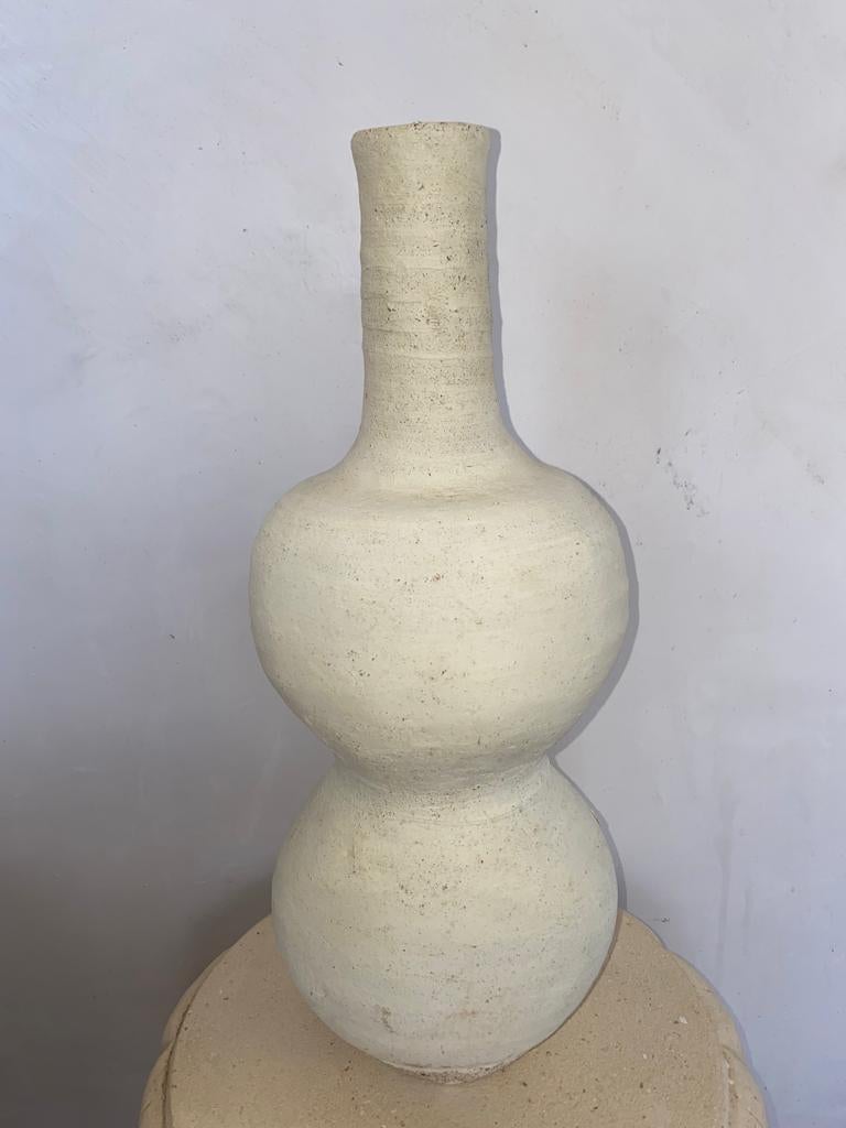 Handmade Tamegroute vase 2 by Contemporary Orientalism.
Dimensions: D 20 x H 46 cm.
Materials: Pottery of tamegroute natural handmade.

