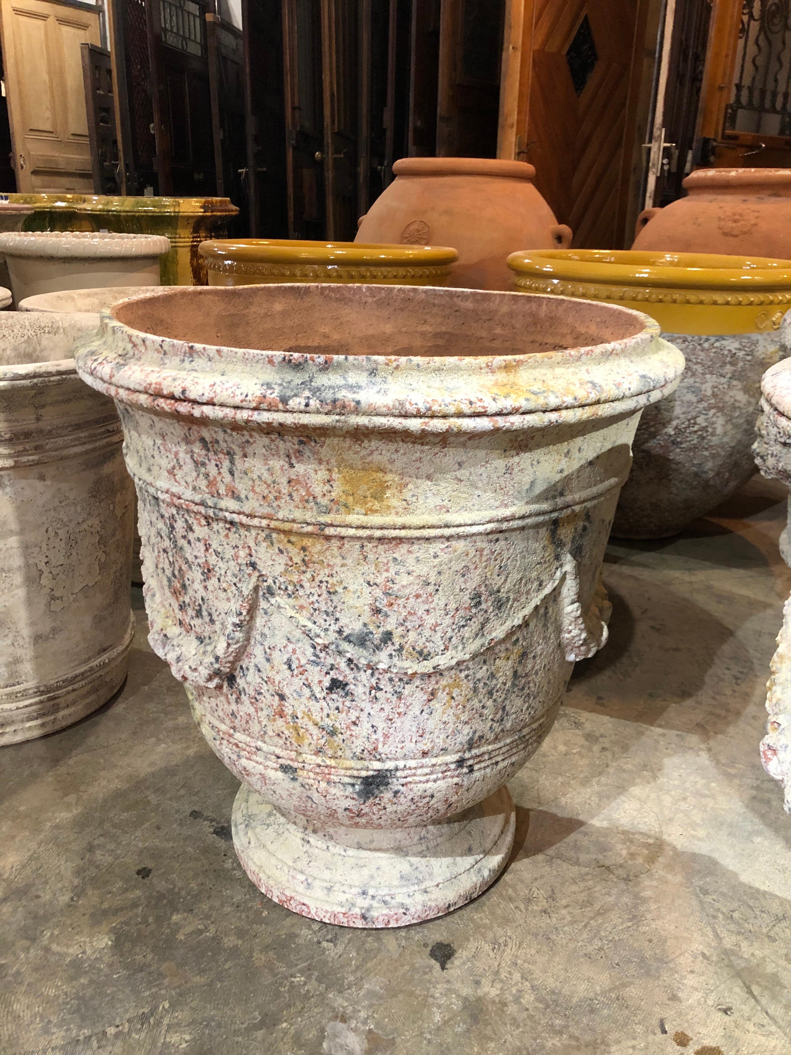 This beautiful handmade terracotta garland urn origins from France.