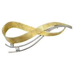 Handmade Textured Infinity Brooch with Diamonds in Two-Tone 14 Karat Gold