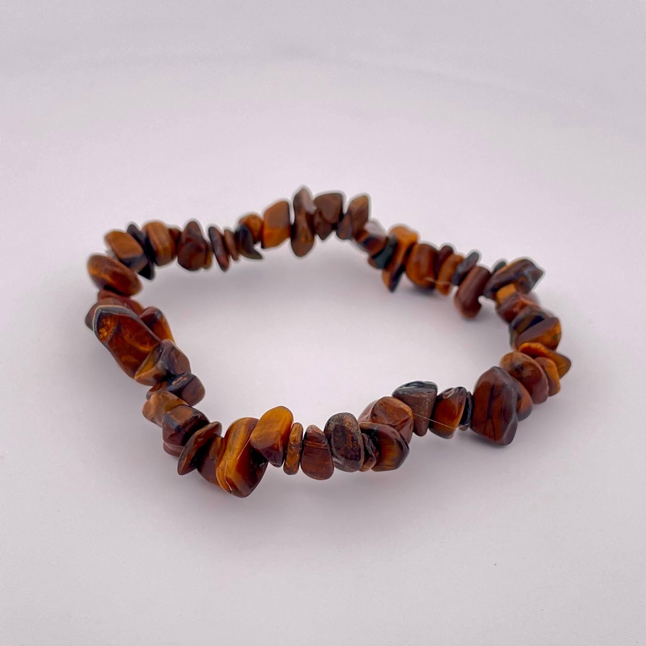 Tipo di gioiello fatto a mano: Bracciale 
Materiale Pietra dell'occhio di tigre 
Dimensioni: Dimensioni libere 
Sesso m: Unisex 
Tipo di materiale: Perline 
Origine Madagascar 



Questo braccialetto fatto a mano con pietre Tiger Eye del Madagascar
