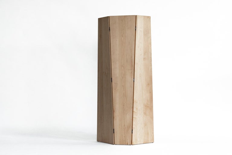 Sculptural, self-supporting screen for use as a stand-alone or combined to create a larger privacy wall. The tri-fold design can be oriented with the form tapering either up or down. 

Shown in solid maple and bronze.

Dimensions: 78” height x