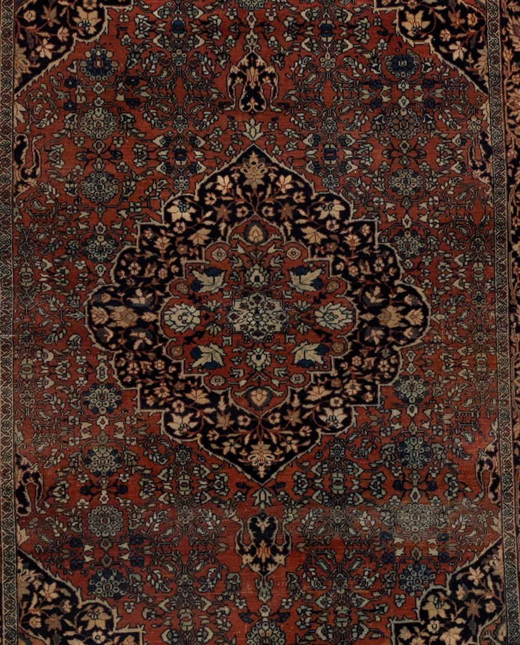 The Tribal Red Blue Floral Rug is a stunning Oriental area rug that boasts a perfectly synchronized floral backdrop and an extraordinary floral centerpiece at its core. Its rich colors and vintage appearance make it an essential piece of home décor