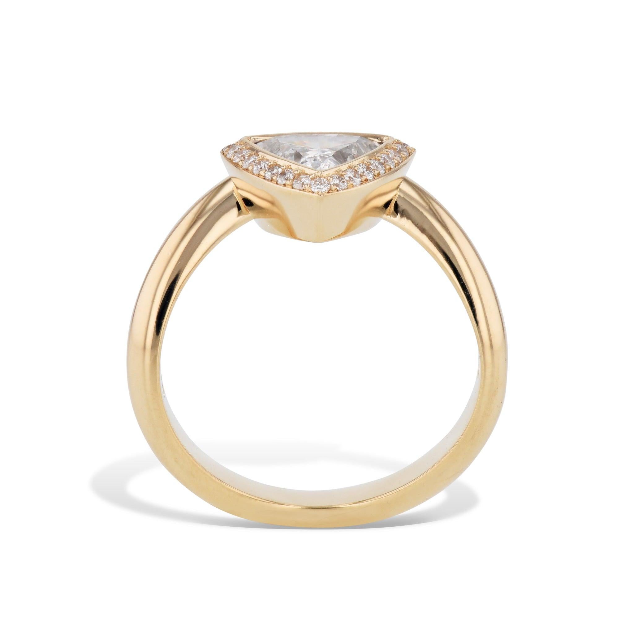 Capture her heart and imagination with a stunning, handmade Trillion Diamond Rose Gold Engagement Ring. This 18kt. beauty features a Trillion Cut center diamond, surrounded by pave diamonds. Make a bold statement and declare your love with this ring