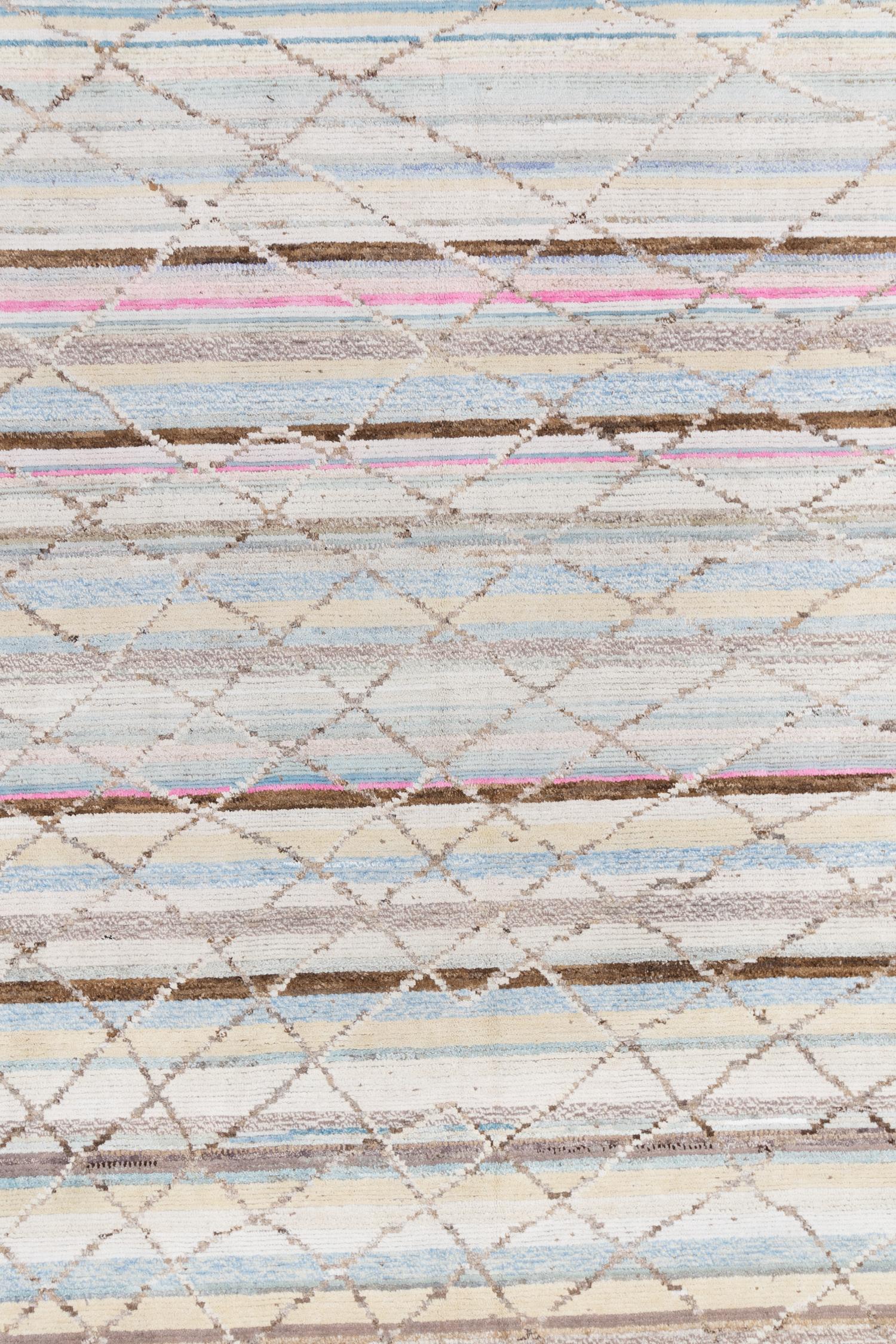 This soft handmade wool rug features a soft pastel with a bit of playful pop in color. The organic trellis pattern adds visual interest. 
 
Wear Guide: New

Wear Notes: 
Vintage and antique rugs are by nature, pre-loved and may show evidence of