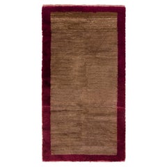Alfombra Tulu hecha a mano con campo marrón y borde rojo. 100% lana. Opciones personalizadas Aval.