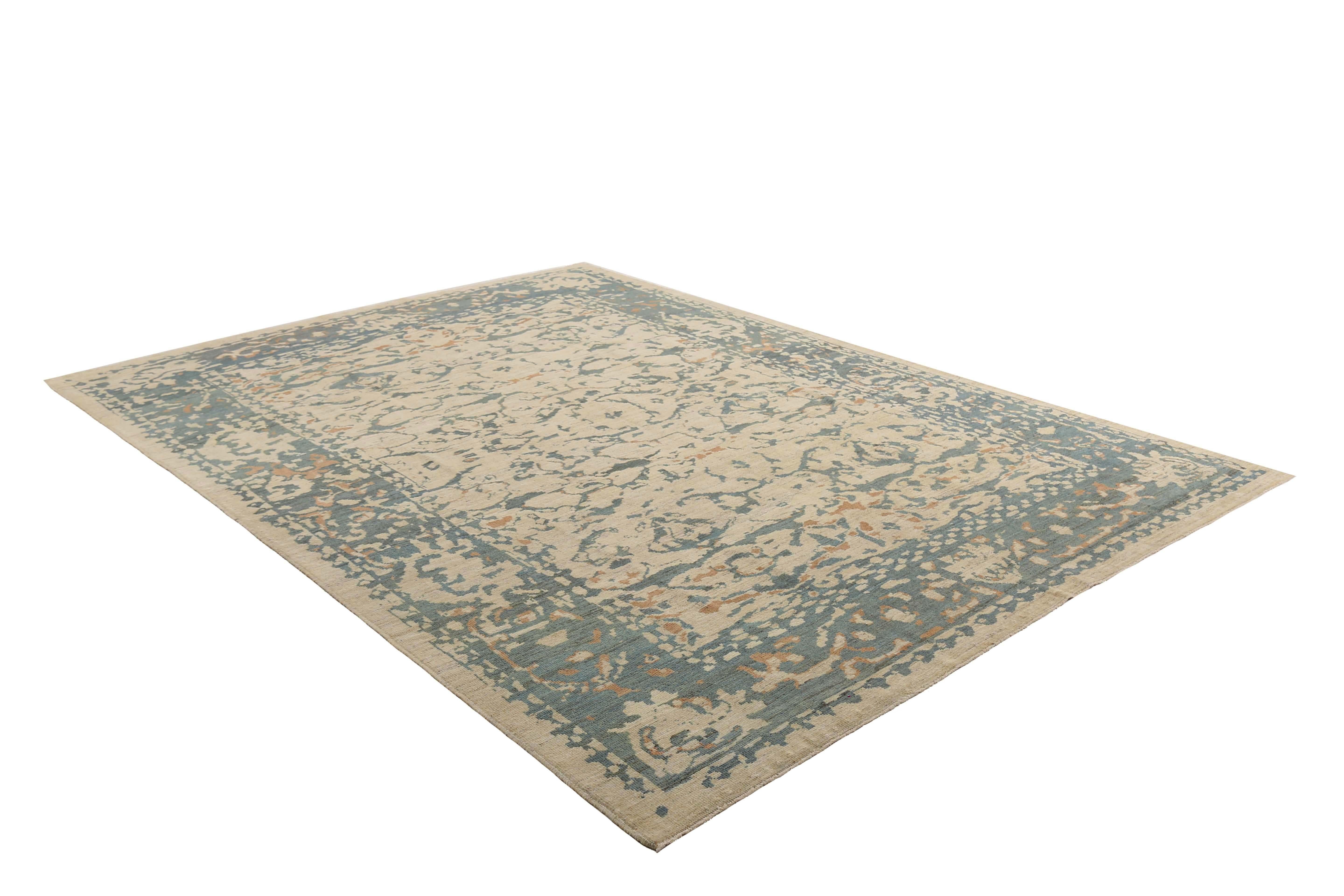 Add a touch of modern elegance to your home with this stunning handmade Turkish Sultanabad rug. Measuring 9'5'' by 12'6'', this rug features a beautiful beige background with a unique and eye-catching design composed of blue, green, and orange