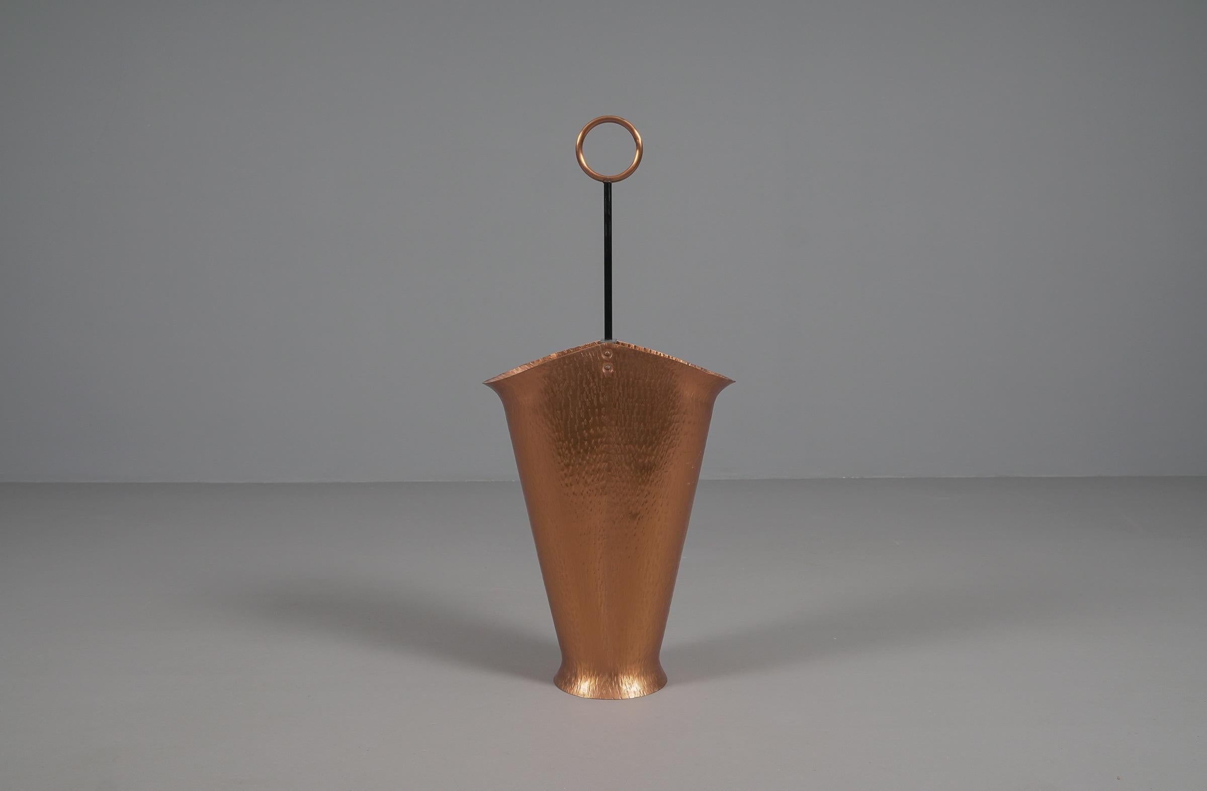 A great mix of materials. Brass and copper with an artistic finish.

