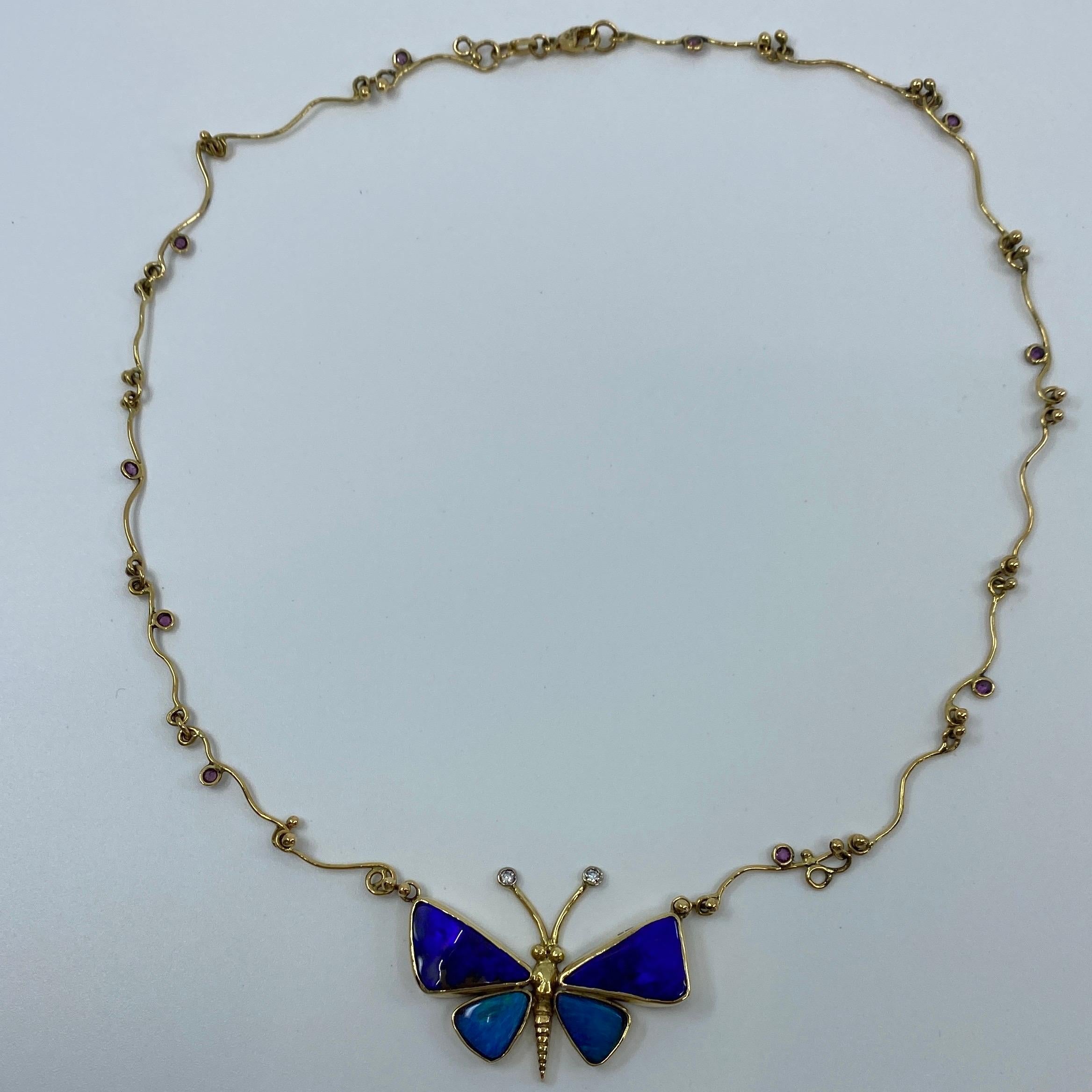 Australian Black Opal, Diamond & Sapphire Butterfly Handmade 18k Gold Necklace.

This is a unique handmade necklace with a beautiful butterfly design.

The necklace is completely handmade in 18k yellow gold with 4 specially cut black opals (with