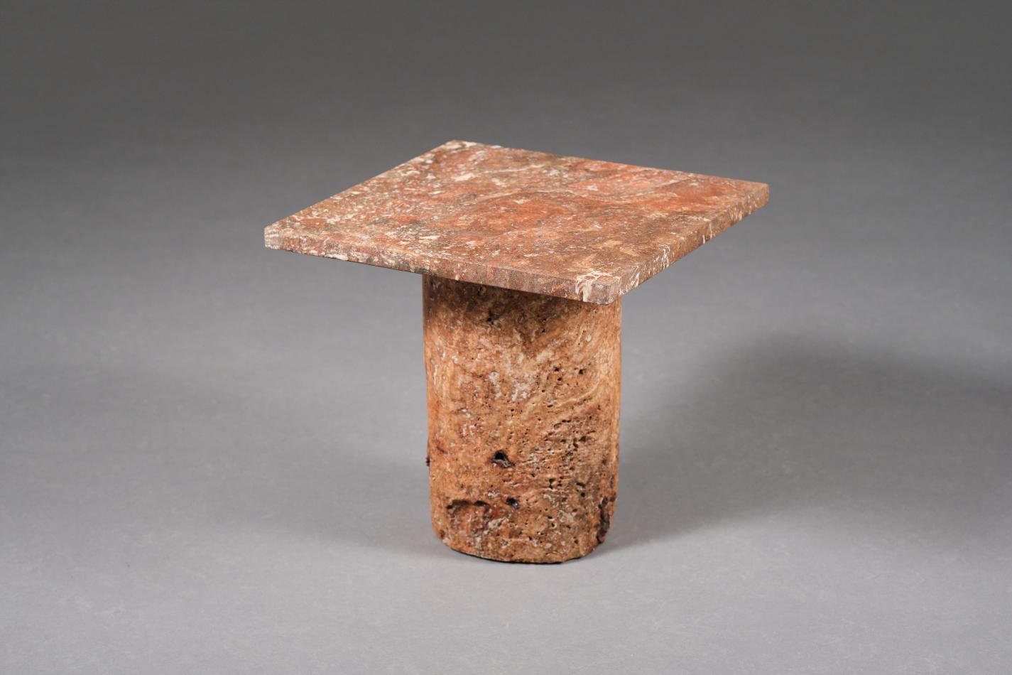 Handmade unique rusty red travertine side table Coral by Josep Vila Capdevila. This piece was tested by the author, who subjected the stone to a sulfuric acid bath to remove its organic part , leaving only the mineral particles.
The collection