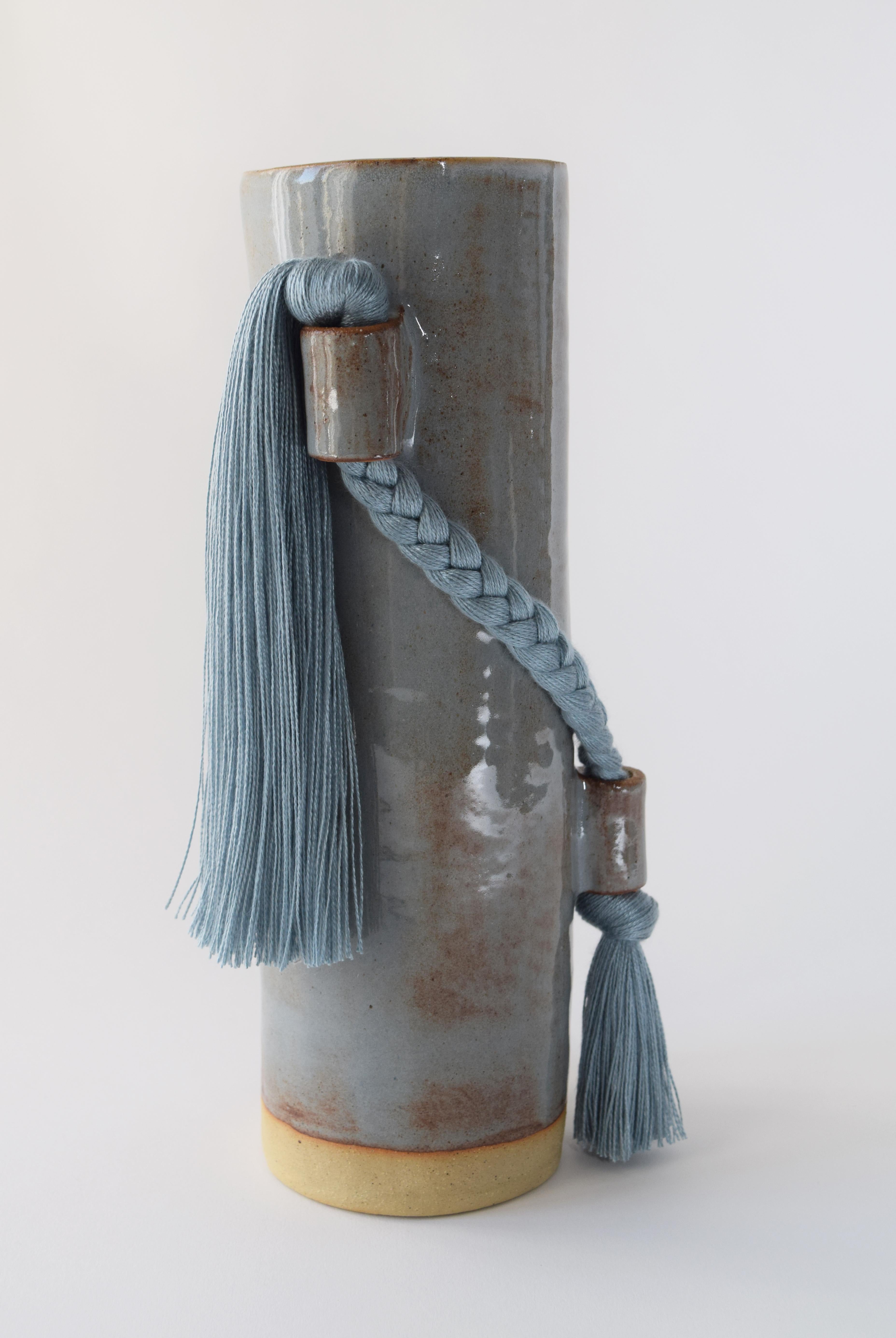 Vase #695 by Karen Gayle Tinney

Equal parts functional and sculptural, this vase is the perfect size for a small bouquet but packs enough detail for it to stand alone as a decorative object on a shelf or table.

Hand formed stoneware with blue