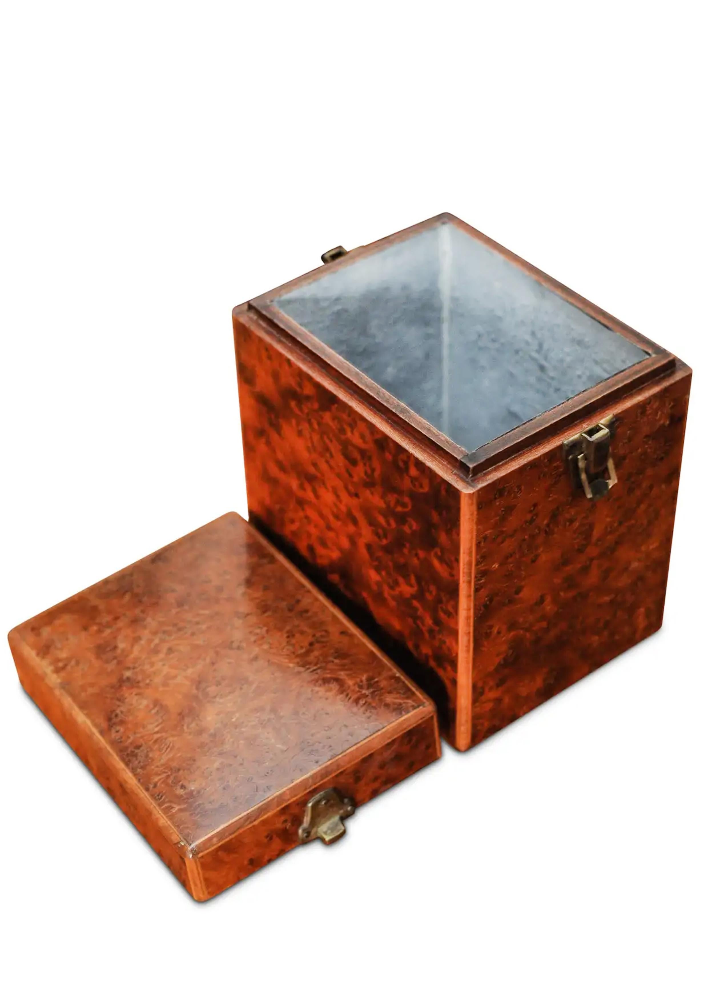 A Handmade Victorian Burr Walnut & Inlay Tea Caddy With Brass Hinges

A tea caddy is a box, jar, canister, or other receptacle used to store tea. When first introduced to Europe from Asia, tea was extremely expensive, and kept under lock and key.