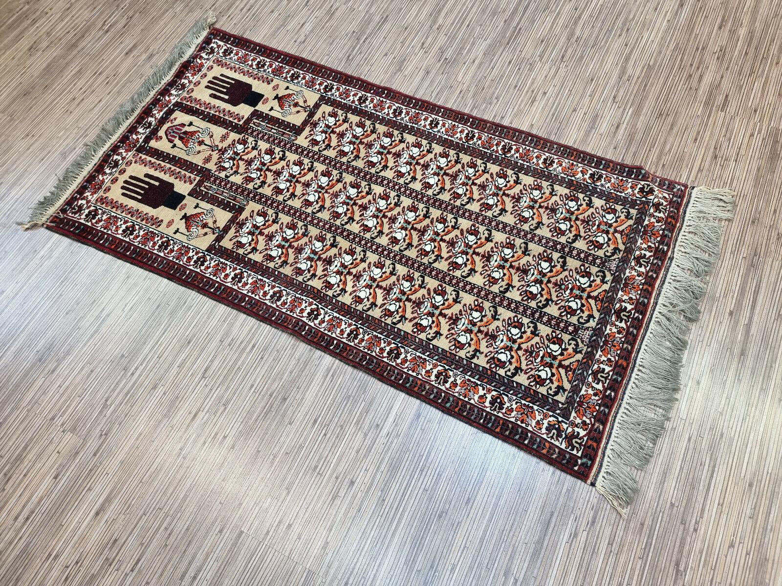 Add a touch of tradition and elegance to your space with our Handmade Vintage Afghan Baluch Rug. This stunning piece is a prayer rug that dates back to the 1960s, yet it remains in good condition and retains its original charm. Made from the finest
