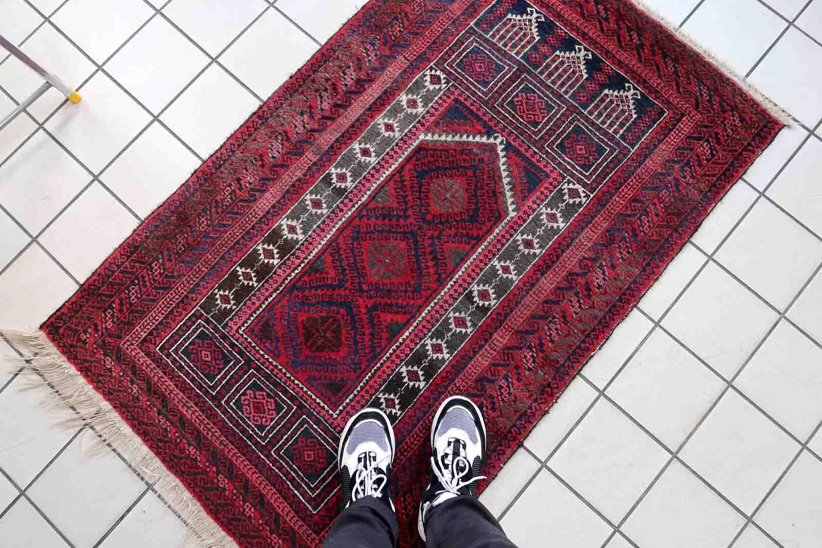 Handmade vintage Afghan Baluch rug in red and night blue colors. The rug is from the beginning of 20th century, it is in original good condition. This rug is prayer.

-condition: original good,

-circa: 1940s,

-size: 3' x 4.9' (94cm x